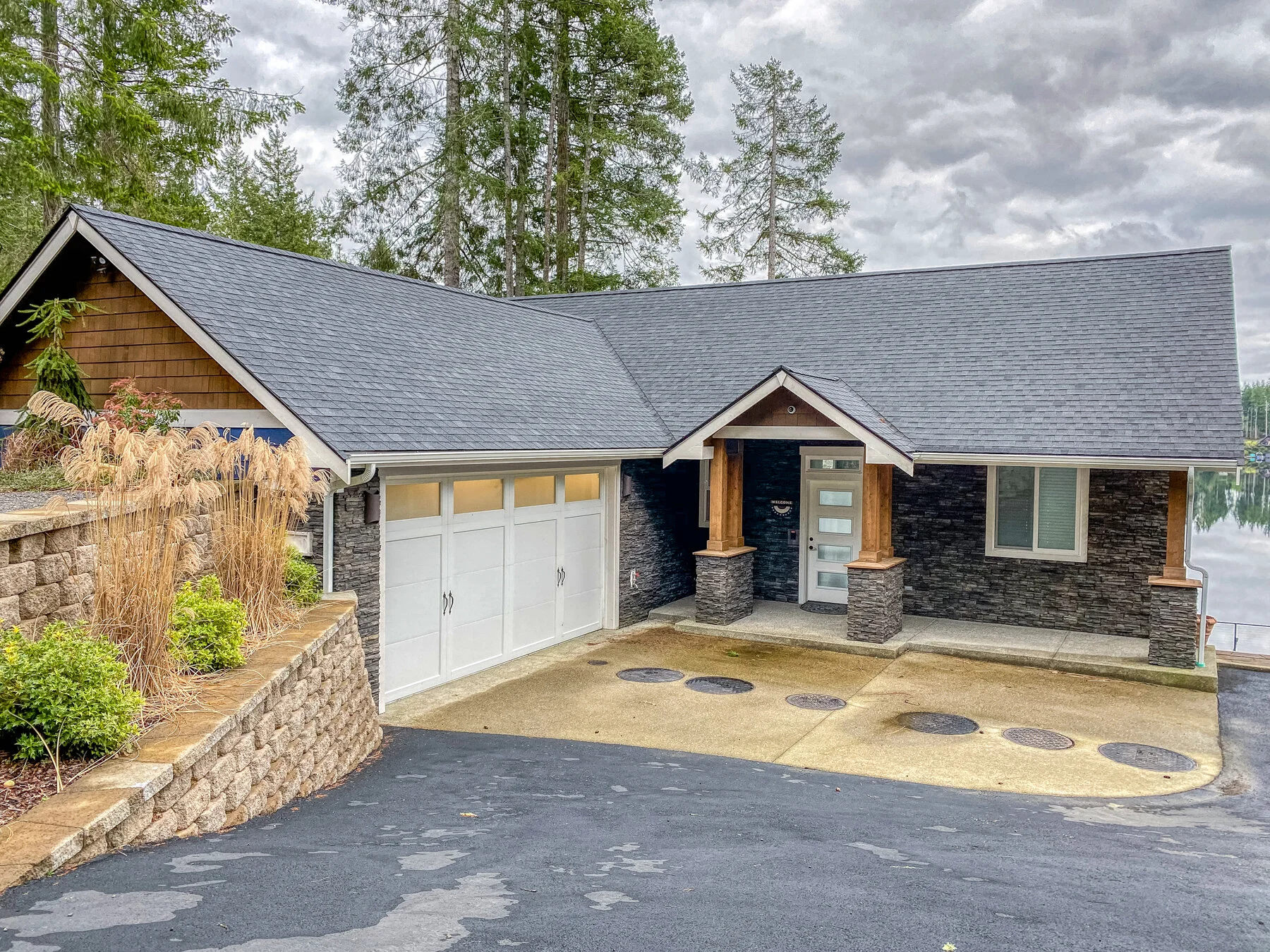 Ross's lakefront custom home on Mason Lake - craftsman exterior with multi-car garage - FoxHead Construction Mason County