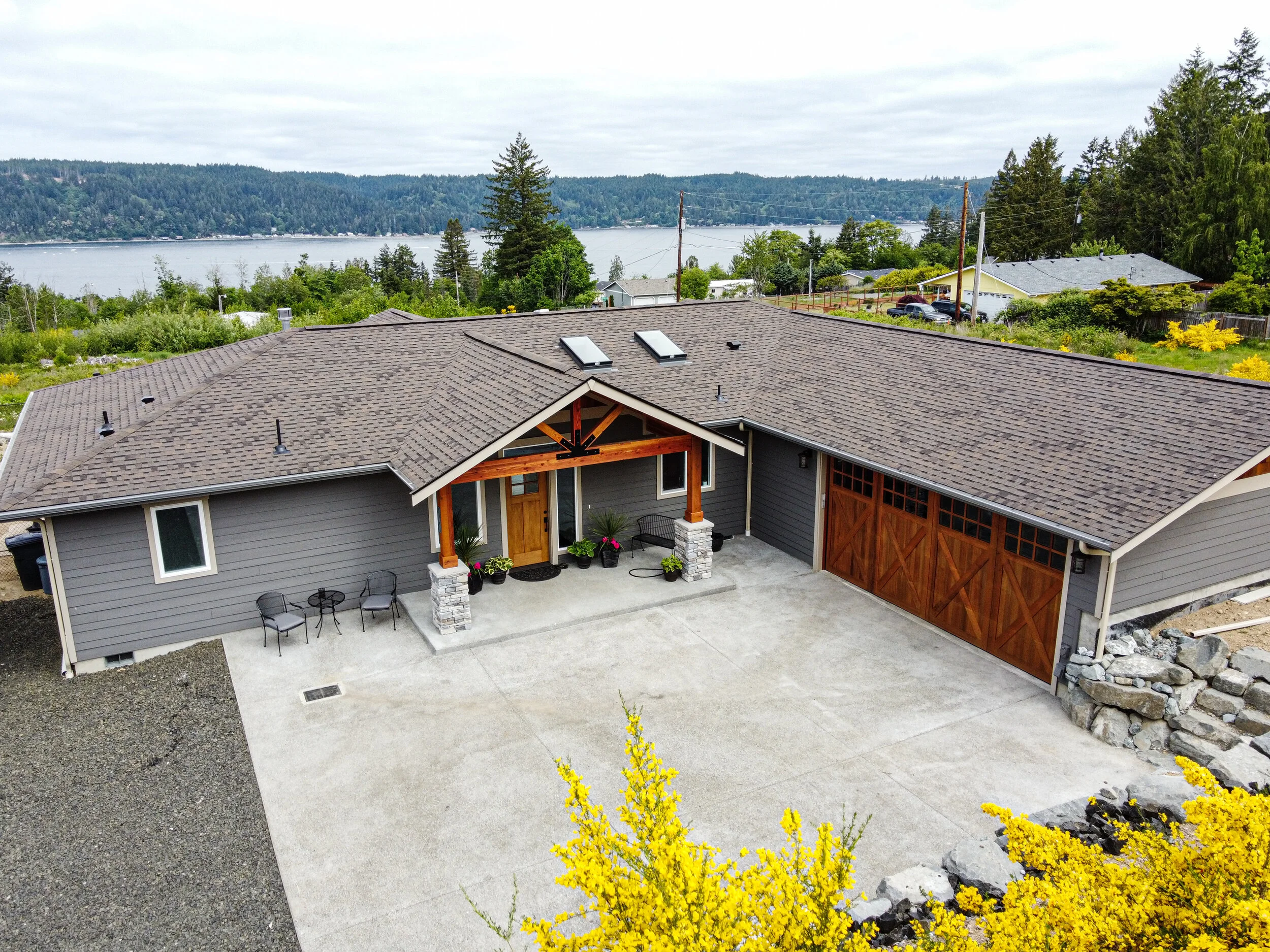 Jason's custom home in Union with Hood Canal views - craftsman exterior with stone accents - FoxHead Construction Mason County
