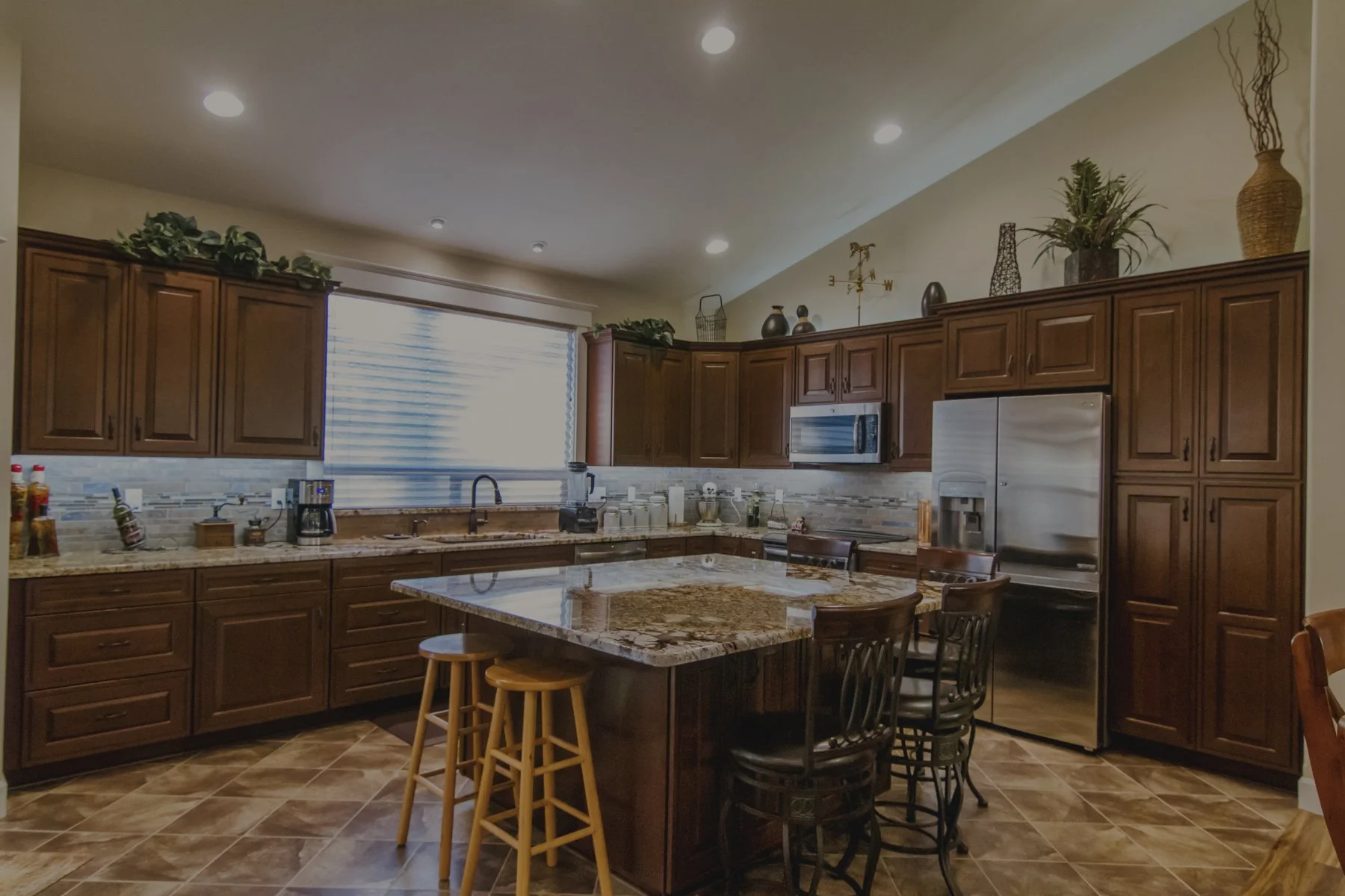 Tom's custom home in Littlerock featuring kitchen with wood cabinetry and horse stables on acreage - FoxHead Construction Thurston County
