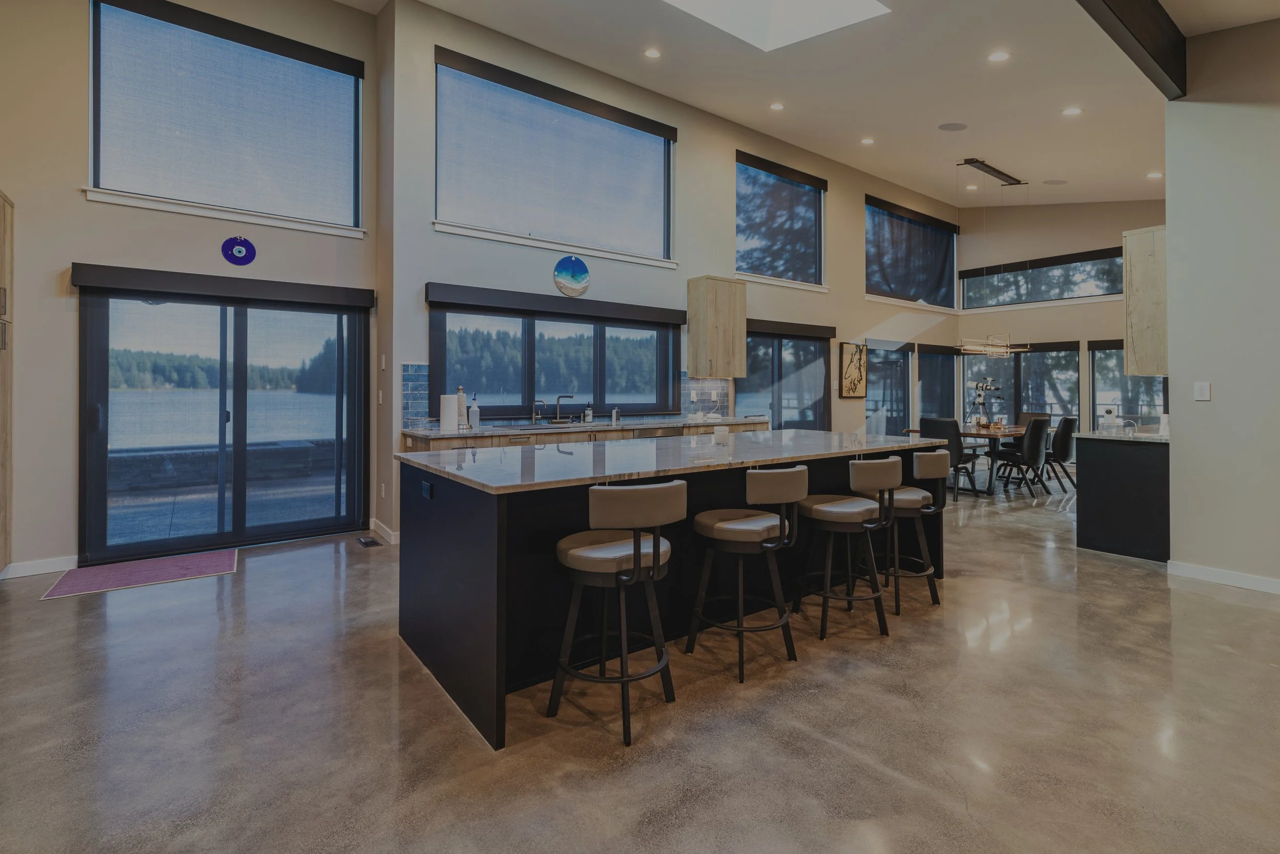 Agoado's contemporary custom home on Pickering Passage featuring waterfront views and open concept living - FoxHead Construction Mason County