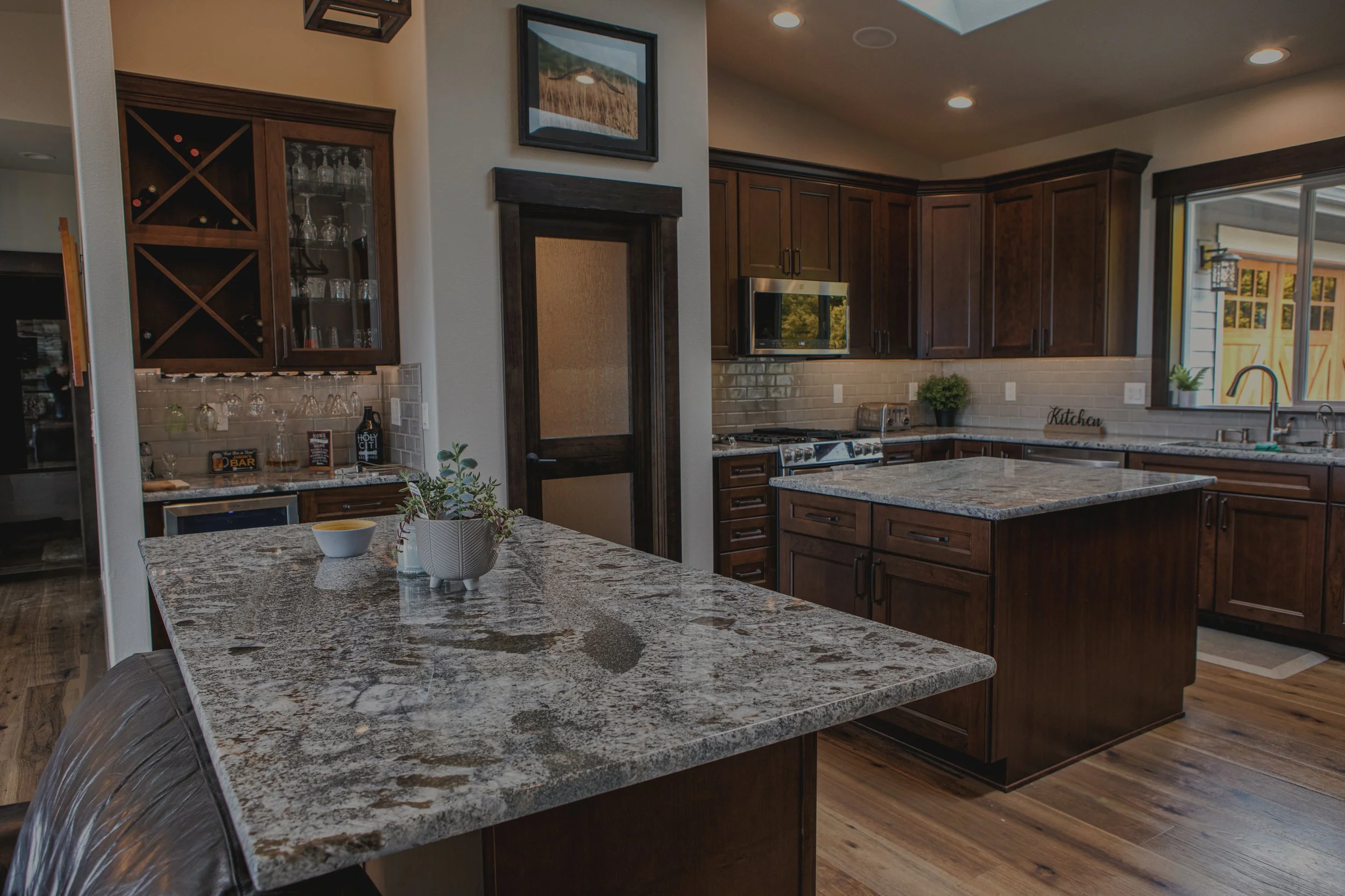 Jason's custom home in Union featuring double island kitchen with Hood Canal views - FoxHead Construction Mason County