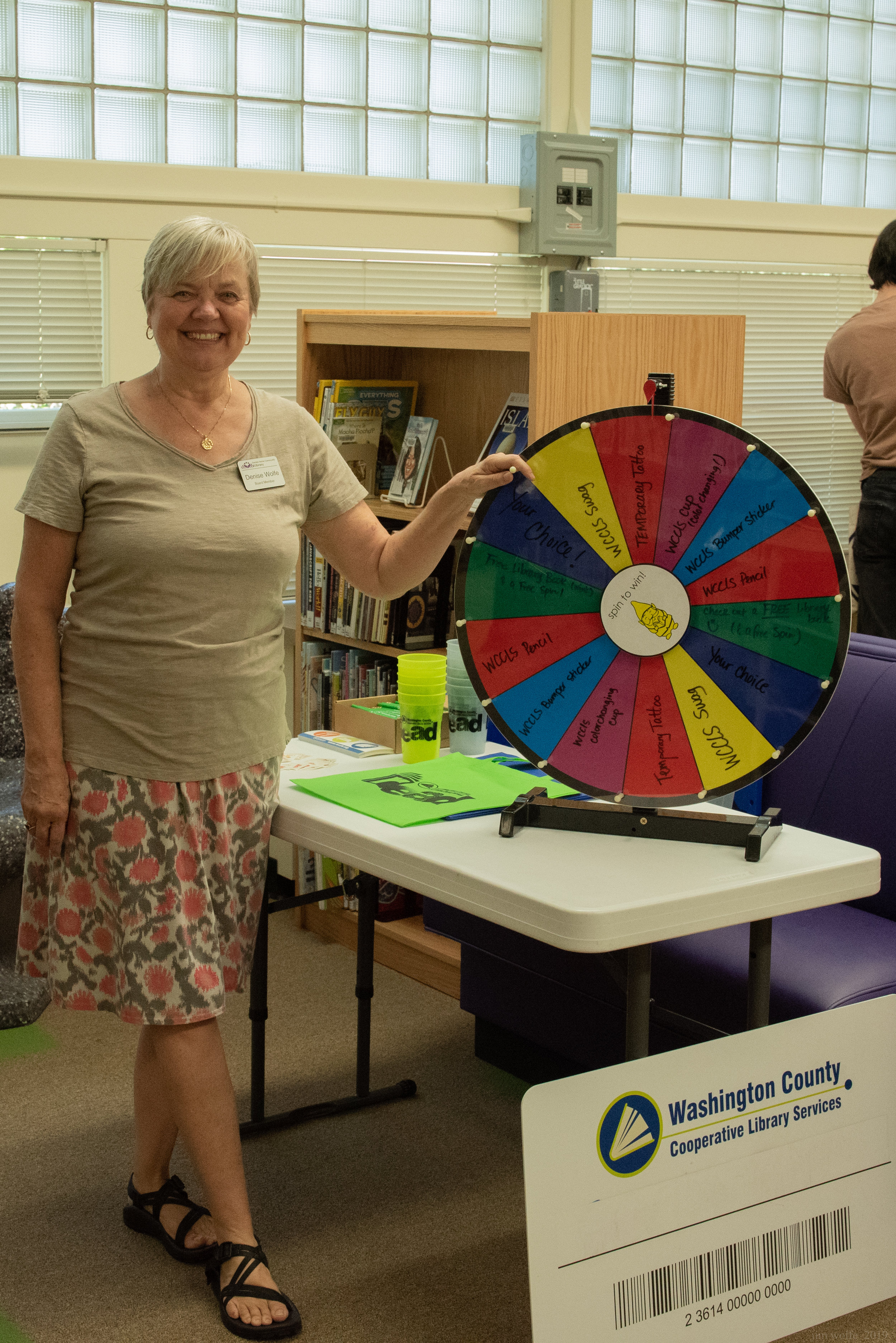 Board Member Denise Wolfe plays Vanna White at the prize spinner 