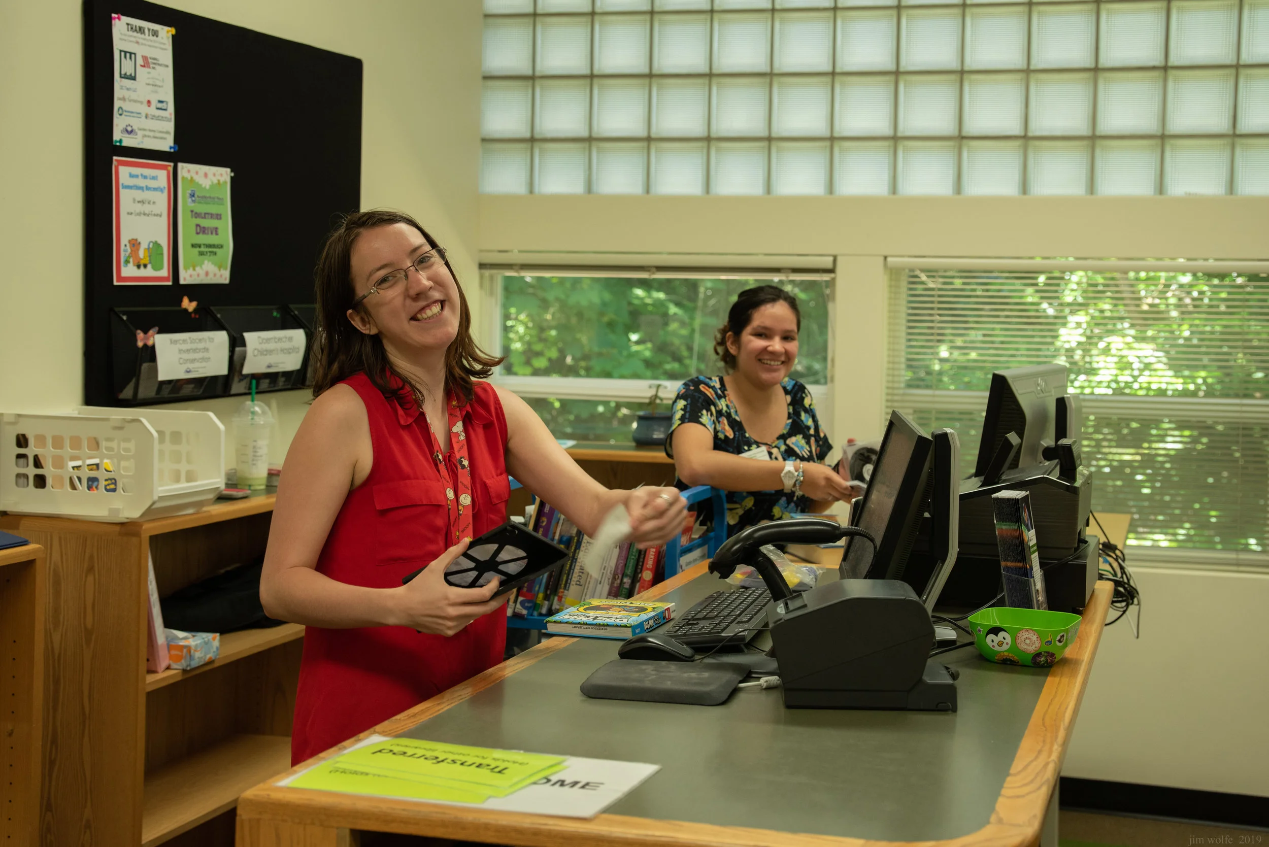 Staff Members Julie Winczewski and Jocelyn Santos at the circulation desk.