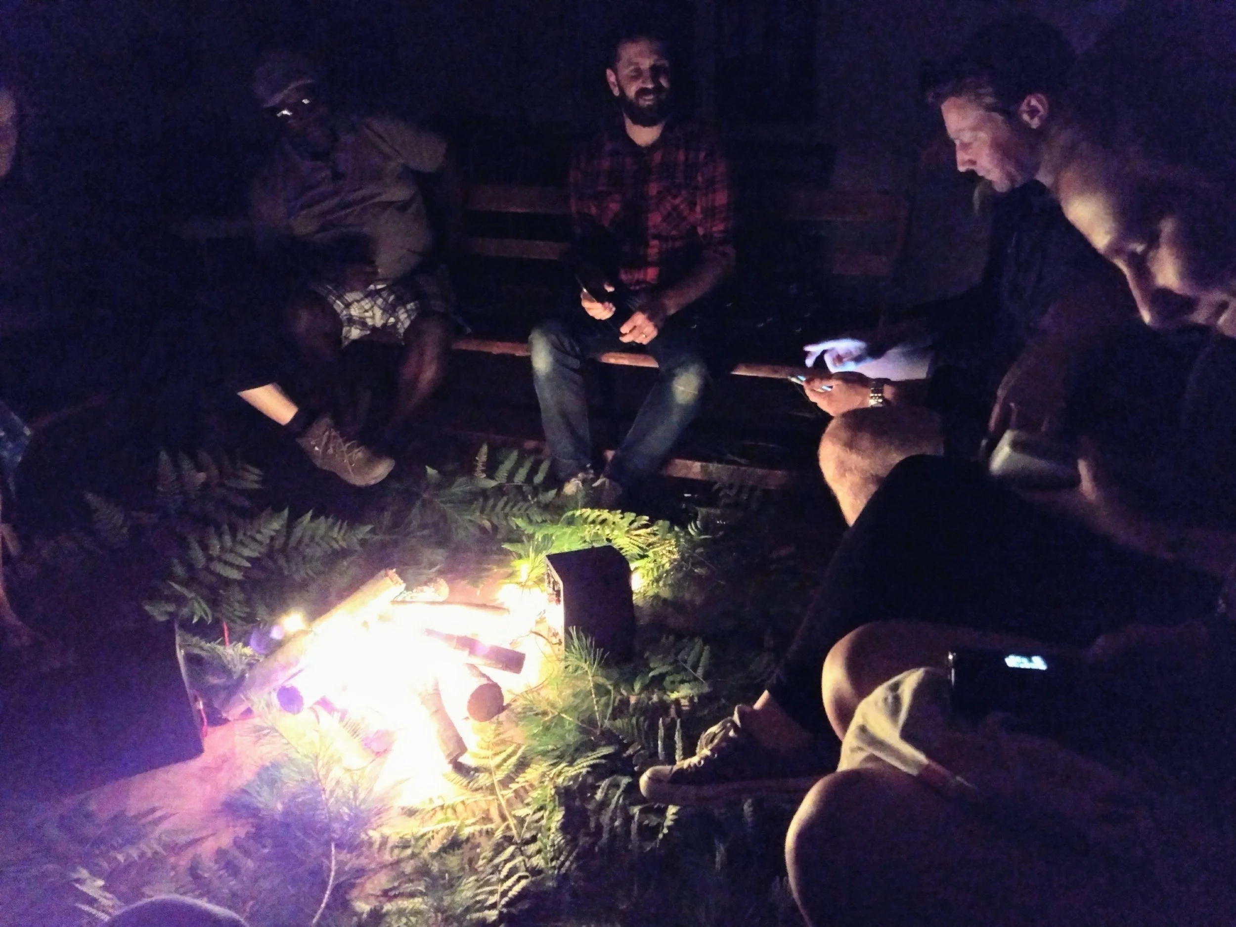 Students at a nighttime listening event in the Finnish Farmers Club in Monson, Maine.