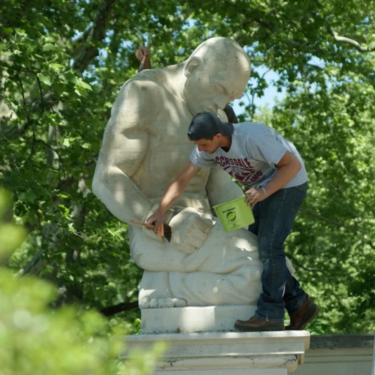 Zach Tatti circa 2016 preforming treatment on an public monument by Hélène Sardeau in Philadelphia.