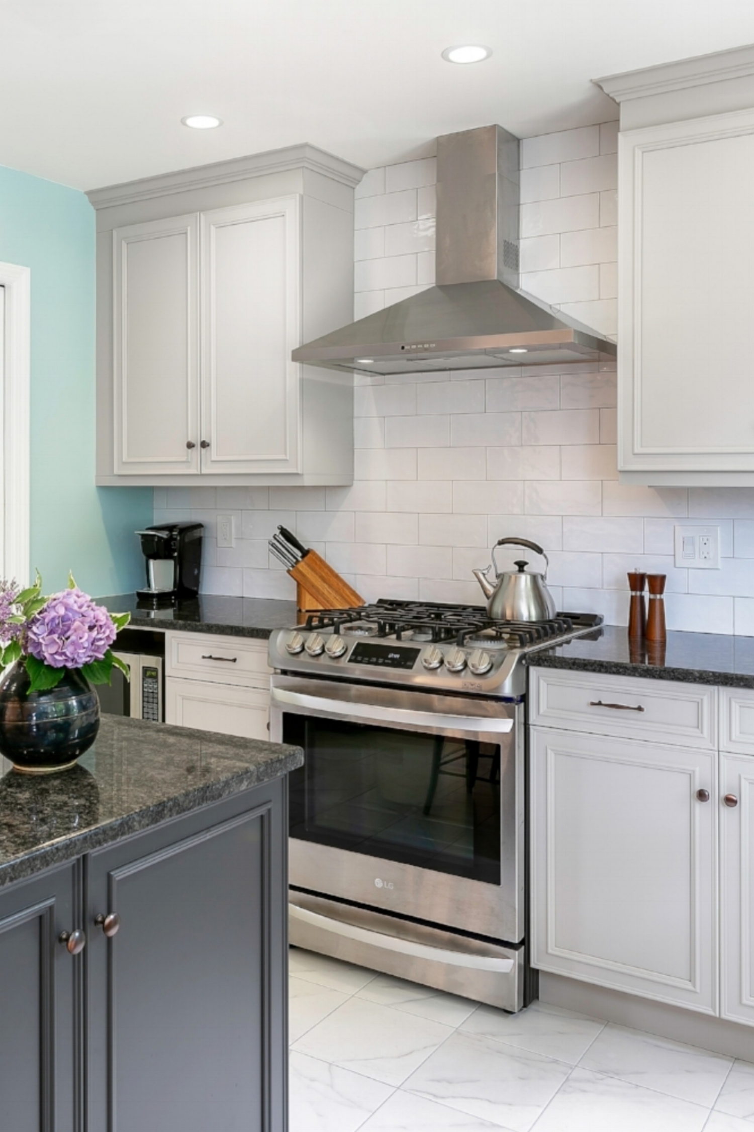 Incorporating an island into the existing kitchen footprint provided much needed counterspace for cooking as well as informal meals.