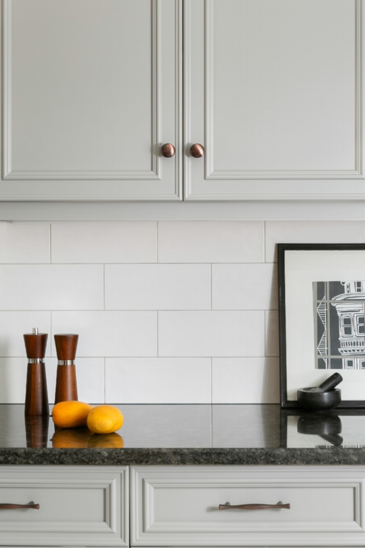  Medium gray cabinets add interest to the kitchen while providing a neutral pallette. 
