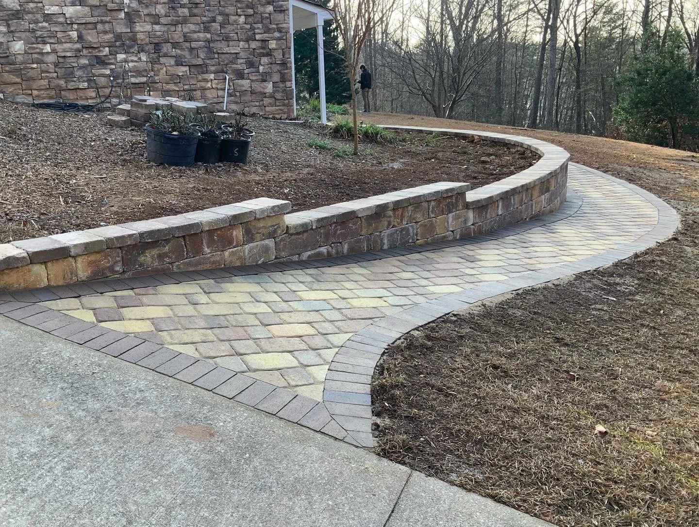 Stone path bordered with dark mulch and curved garden edge in Five Forks, SC