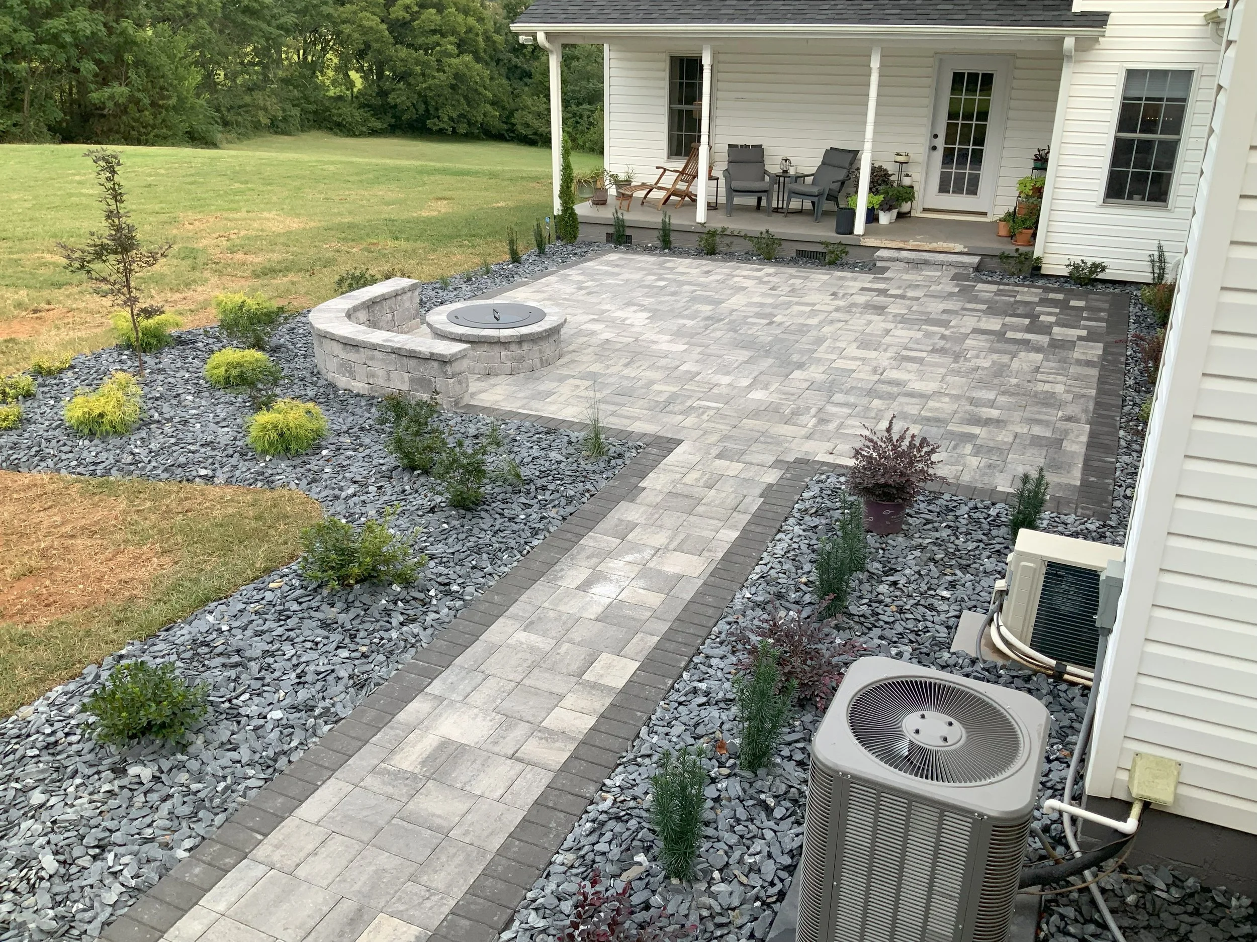Light gray paver walkway and patio with fire feature in Greer, SC