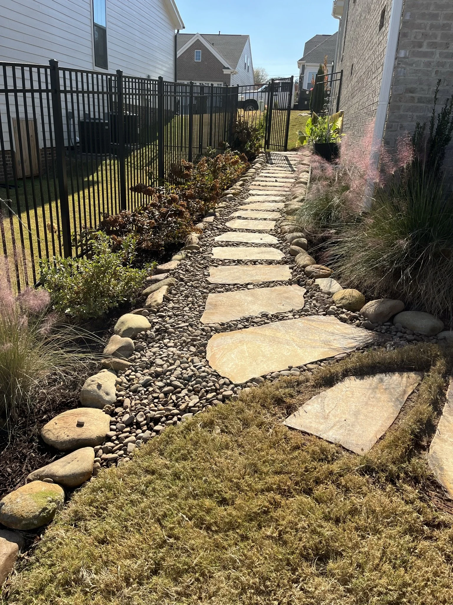 Modern linear paver walkway with metallic planter feature in Mauldin, SC