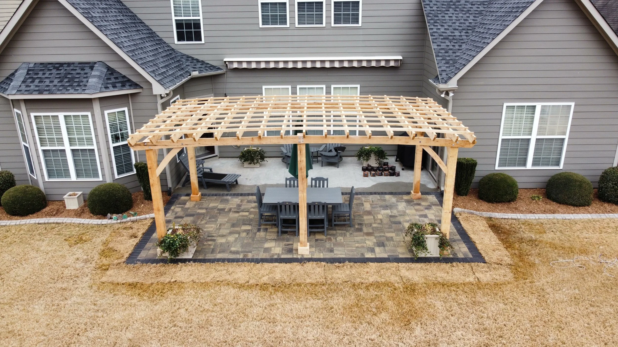 Custom outdoor kitchen and covered patio by an outdoor living specialist in Greenville, SC