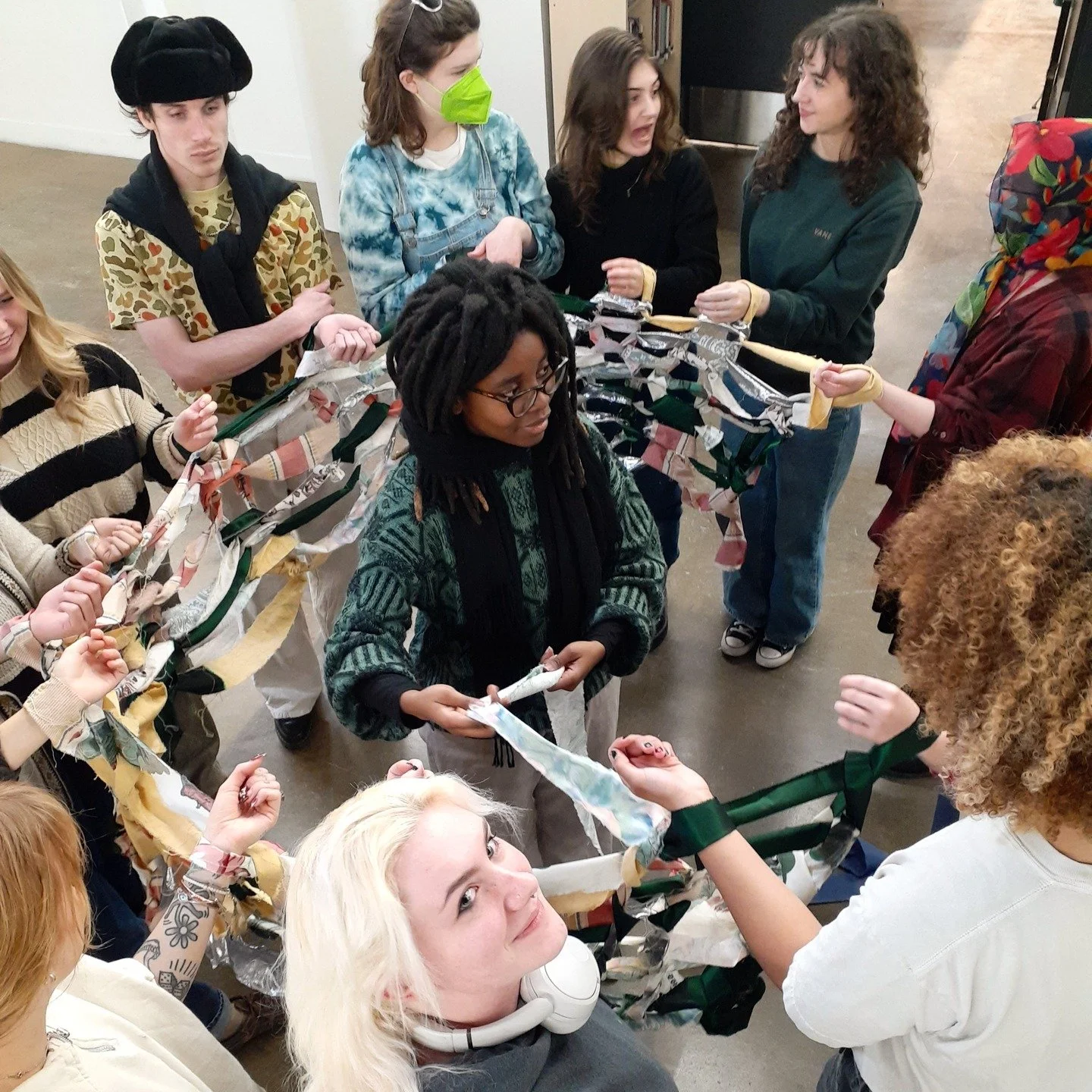 Students in Pauline Verbeek-Cowart's Intro to weaving and fiber properties class joining together for some large scale knitting!
