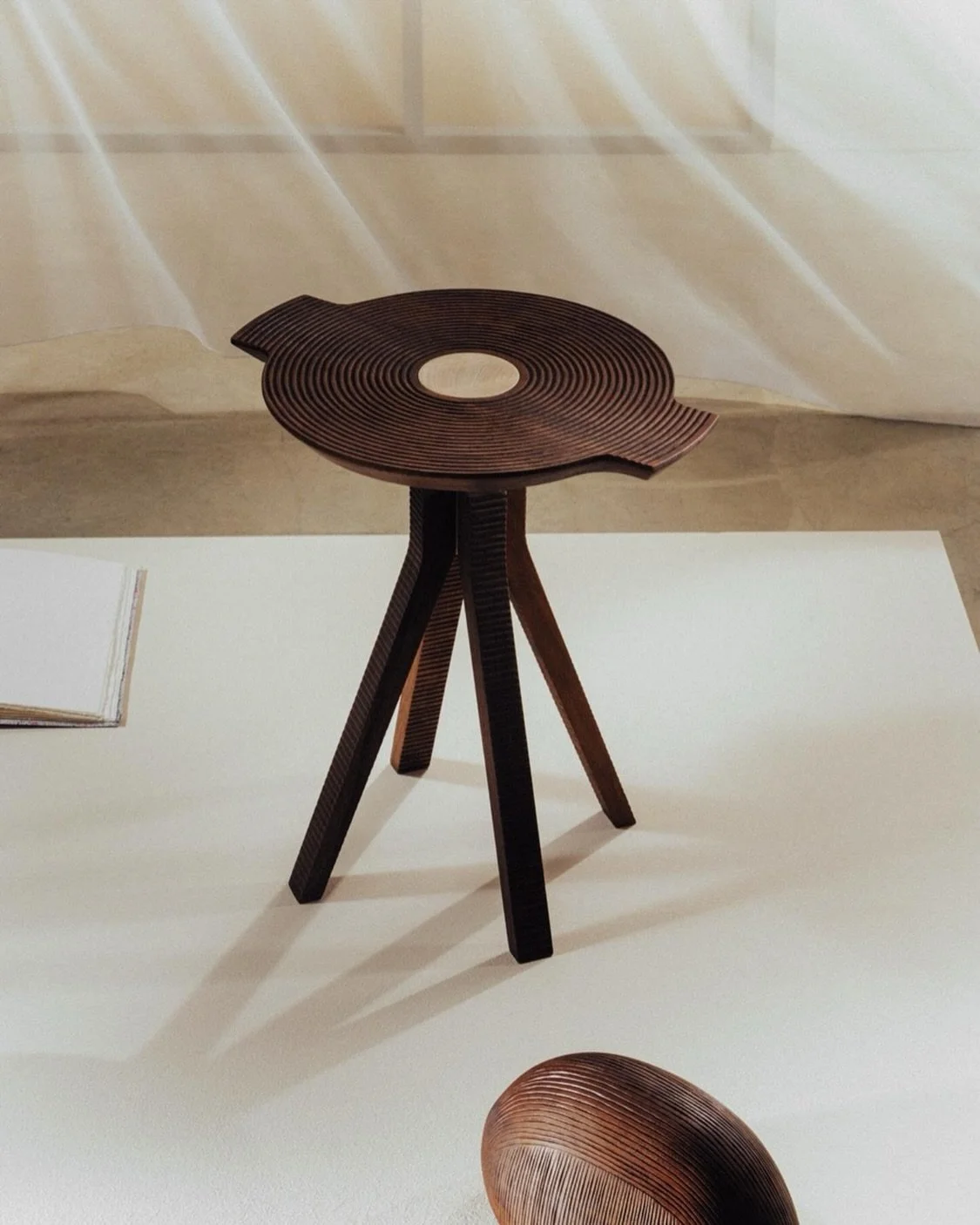 Introducing LP Side Table by @micheledelucchi for @zanatcraft 

Inspired by the form of a long-play vinyl record, LP is defined by hand-carved concentric grooves that bring texture, rhythm and depth to the solid wood surface.

The circular top lifts 