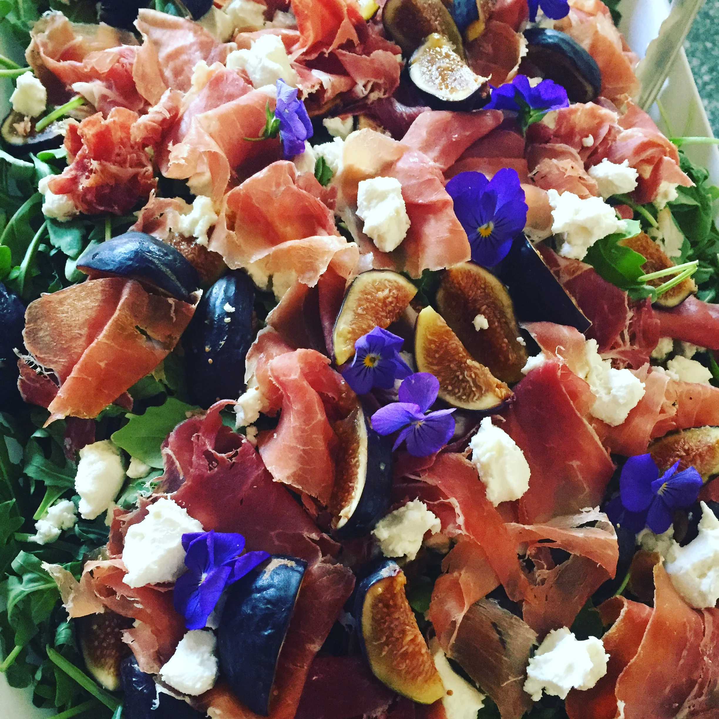Rocket Salad with Fresh Figs, San Daniele Prosciutto and Chèvre with Edible Pansies
