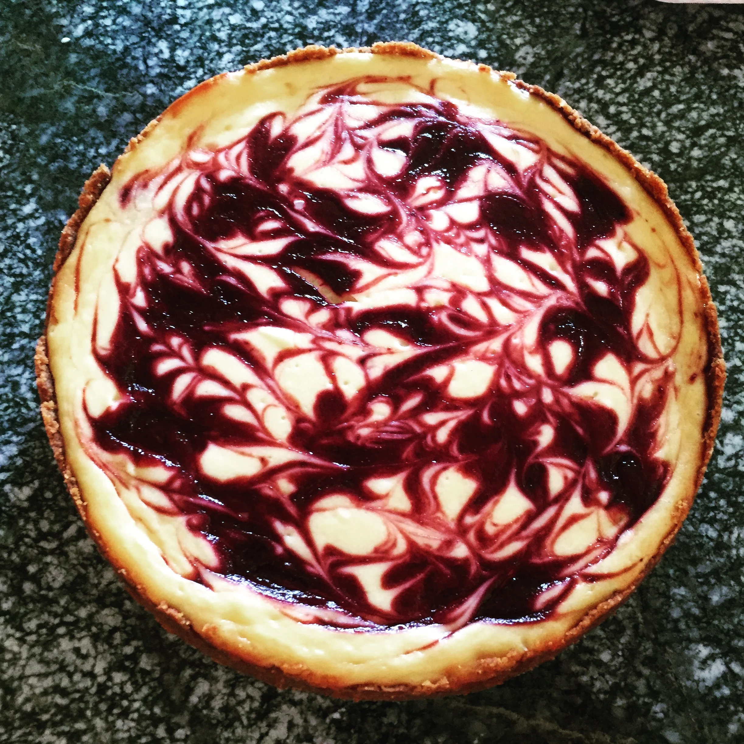Blackberry swirl cheesecake w/ salted caramel vanilla wafer crust
