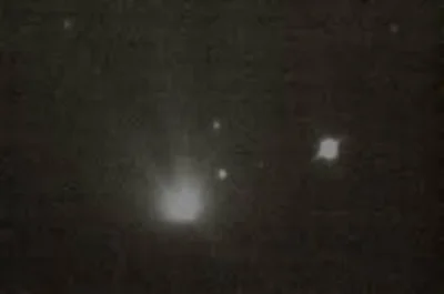 Photo of apparent UFO following the Hale-Bopp comet, taken by Chuck Shramek 