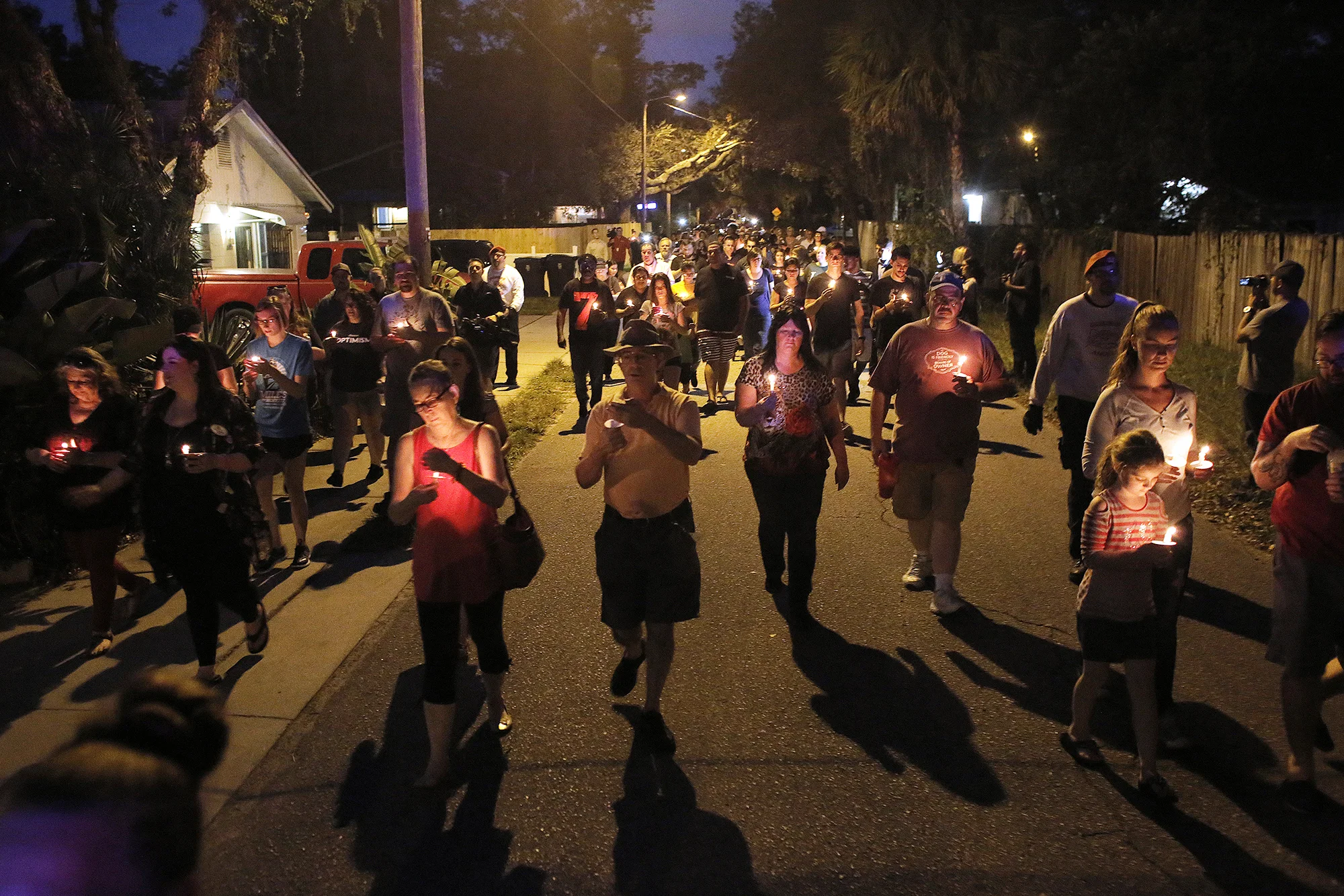 The Seminole Heights community holds a vigil for the victims