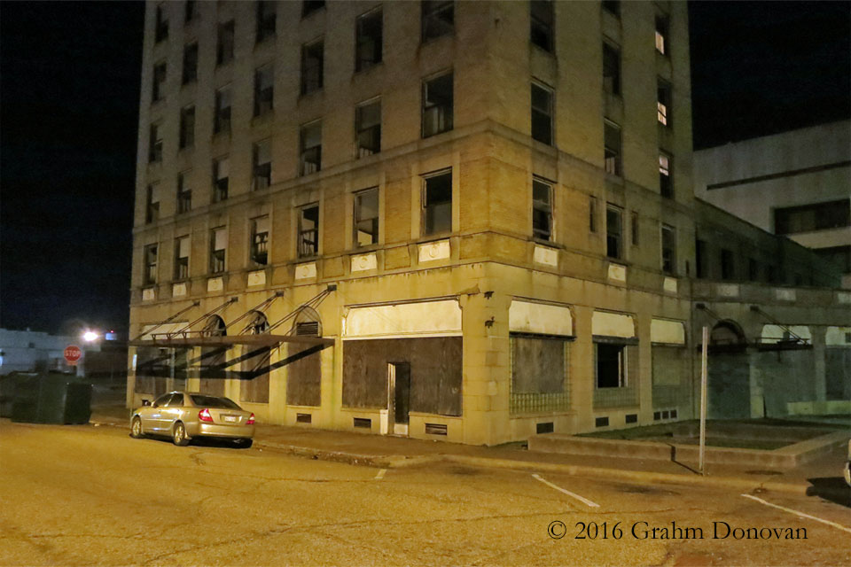 The "Paramount Theatre" and the "Hotel Artney" at night