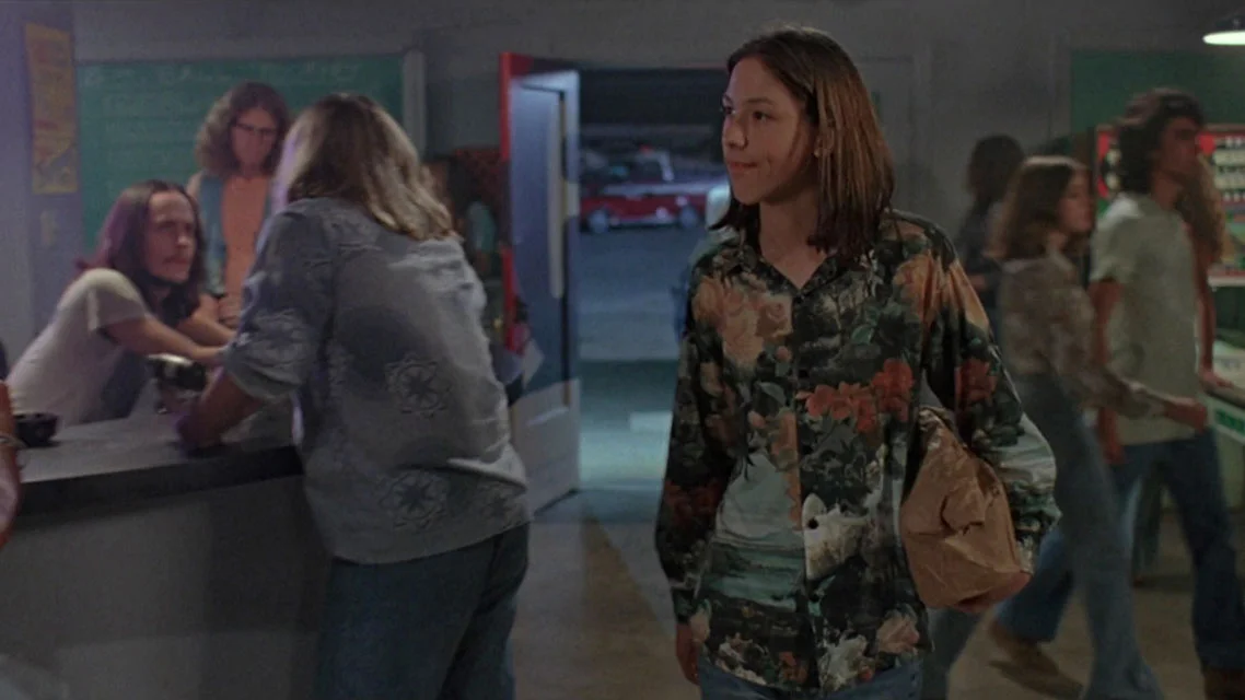 Mitch walks in with the sixer © 1993 Universal City Studios, Inc.