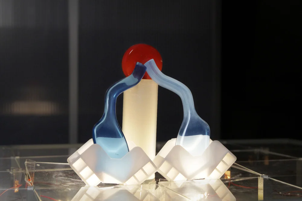 Assemblage lamp: two plastic pieces from solar panels transport, blue and red resin pieces of different densities, plastic cylinder