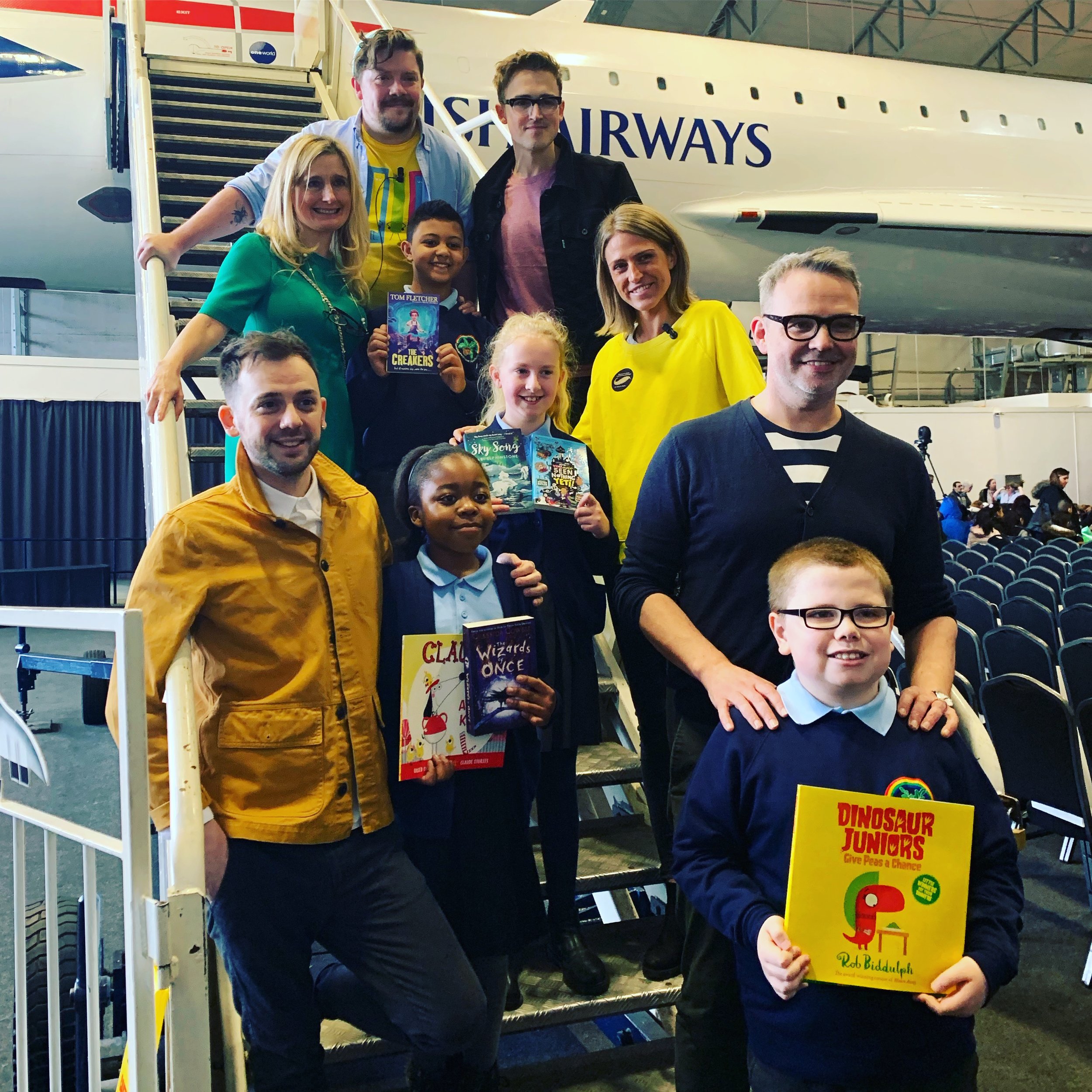 With Steven Butler, Cressida Cowell, Tom Fletcher, Alex T Smith and Abi Elphinstone on the steps of Concorde at our WBD event in Manchester.