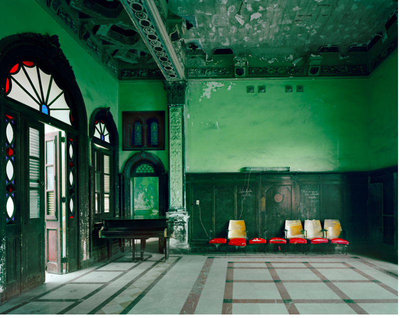 Michael Eastman's large-scale color photographs of Havana explore the decline of the majestic architecture of Cuba's capital. Through Eastman's strong sense of color and elaborate compositional rigor, these images transport the viewer to the streets and interiors of a decaying urban landscape resonant with the stories and echoes of the city’s inhabitants and culture.