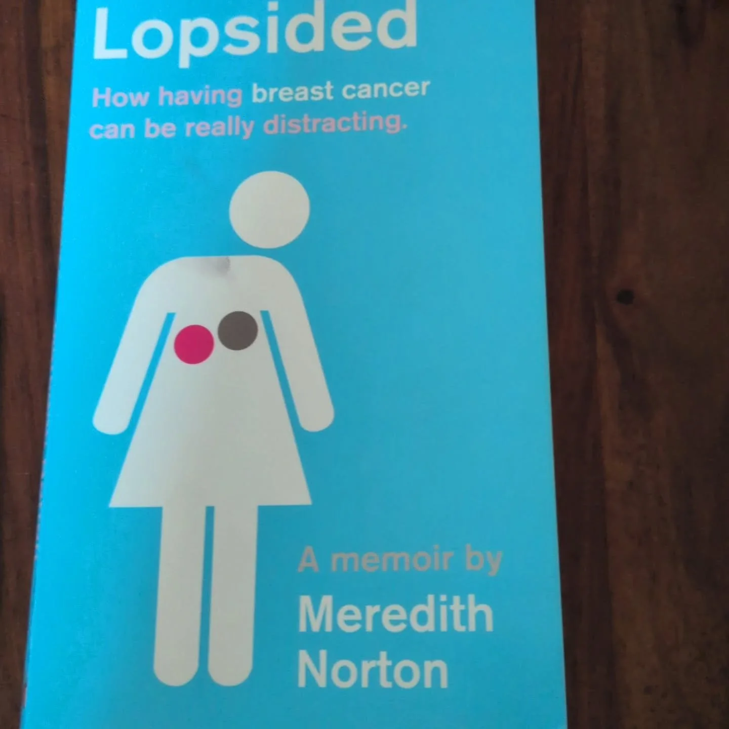 A wry look at breast cancer treatment and so much more. Meredith Norton gives permission for illness not to be inspiring, but to instead be many other things, including disgusting, unpleasant, annoying and sometimes funny. She writes with brutal hone