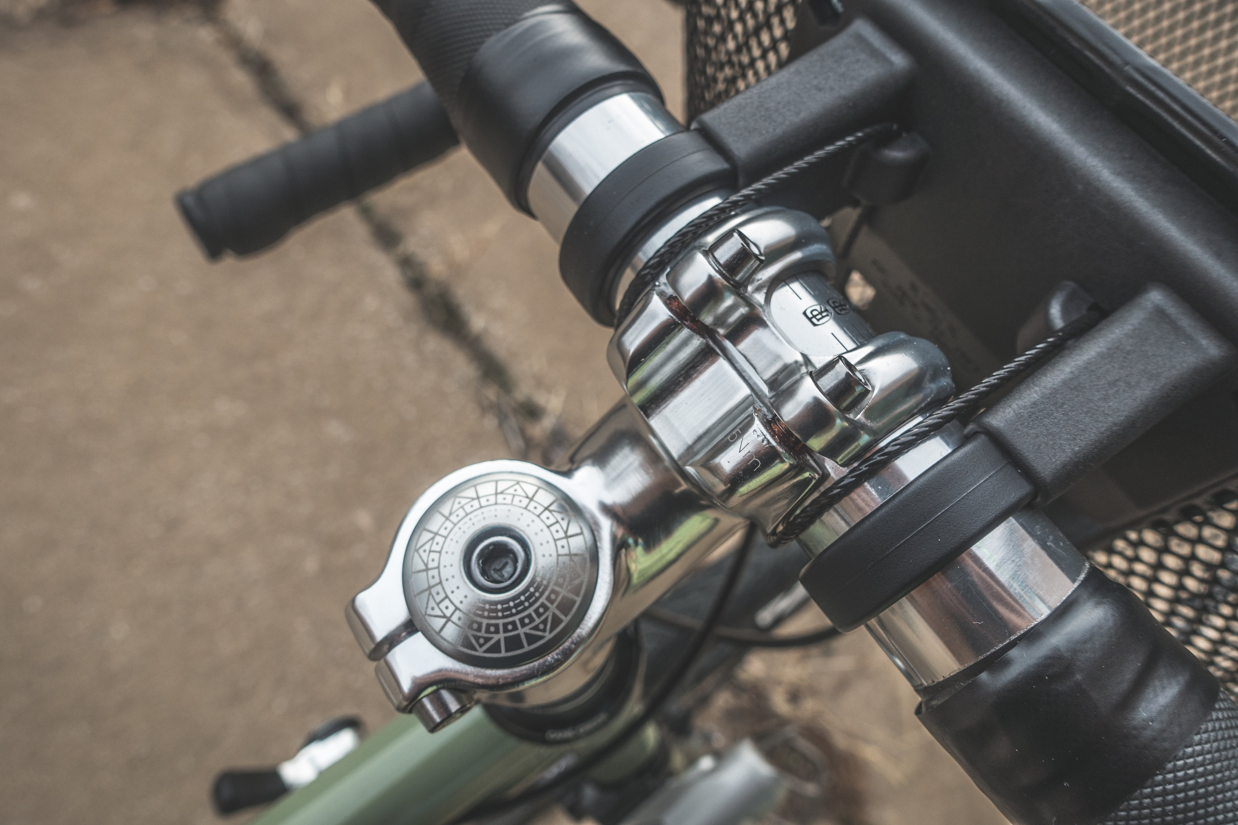 Jay's new Salsa Marrakesh, retrofitted with a dropbar, downtube shifters, a KLICKfix basket, and a pretty mandala headset cap .