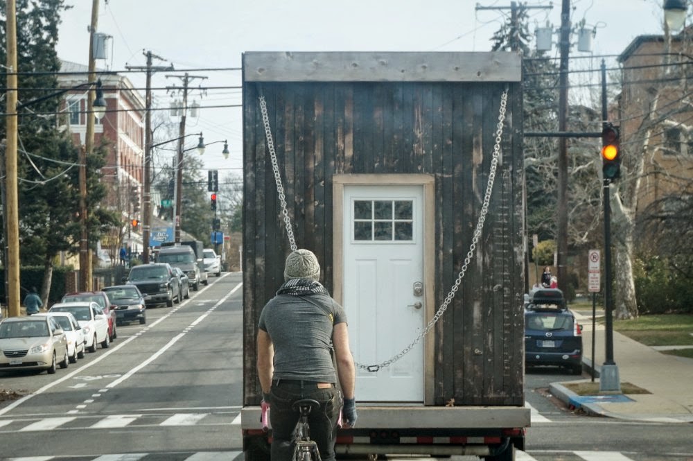 Escorting a tiny house by bicycle through the District of Columbia. 
