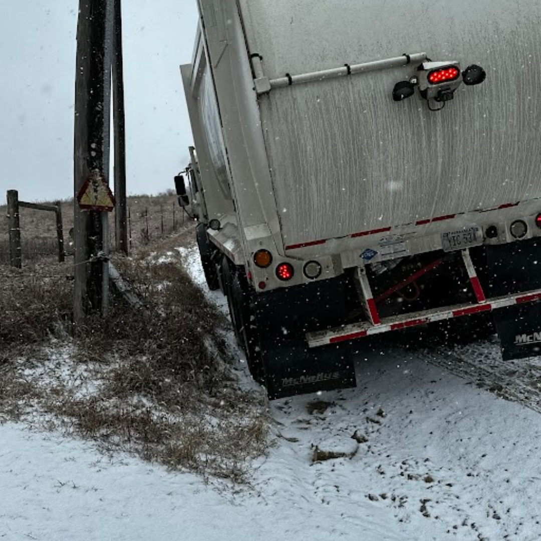Truck fell off road in omaha due to snow.png