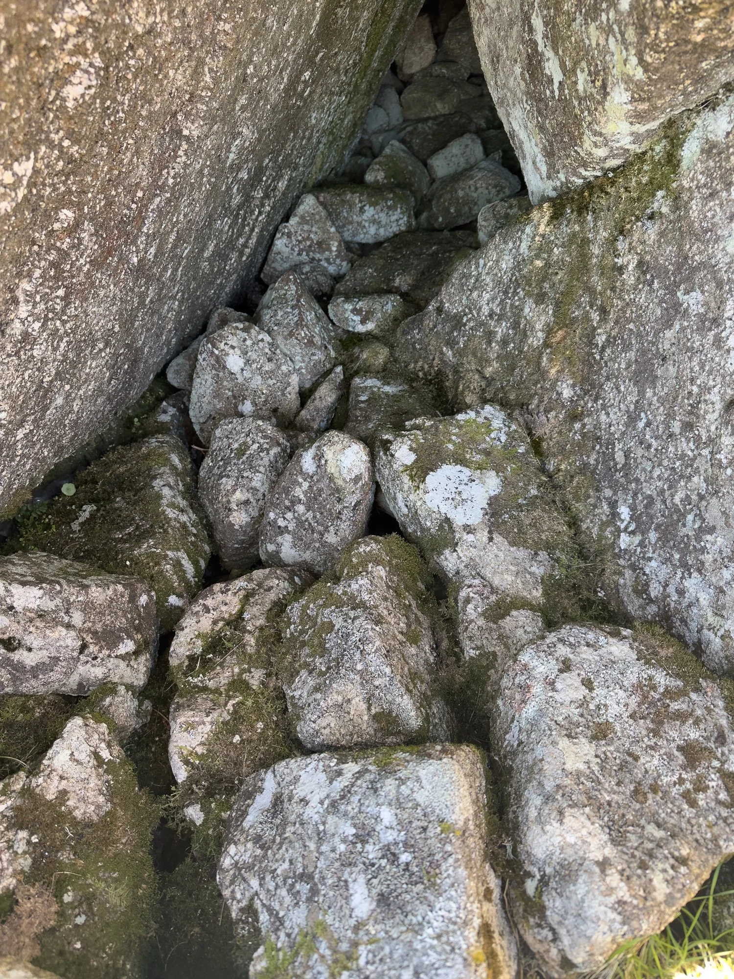 Cairn stones blocking cave, Rough Tor