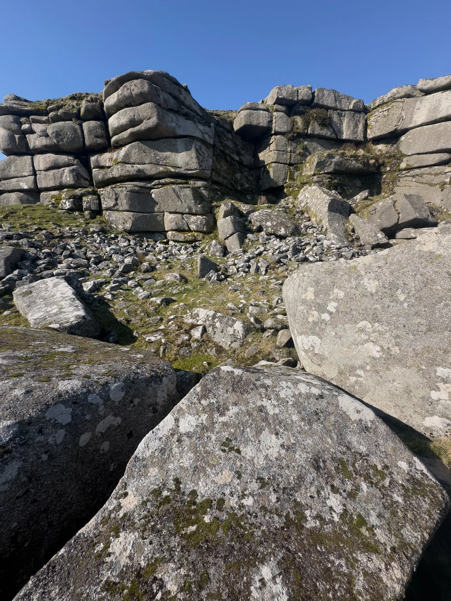 Cave in Rough Tor, with cairn material spilling below
