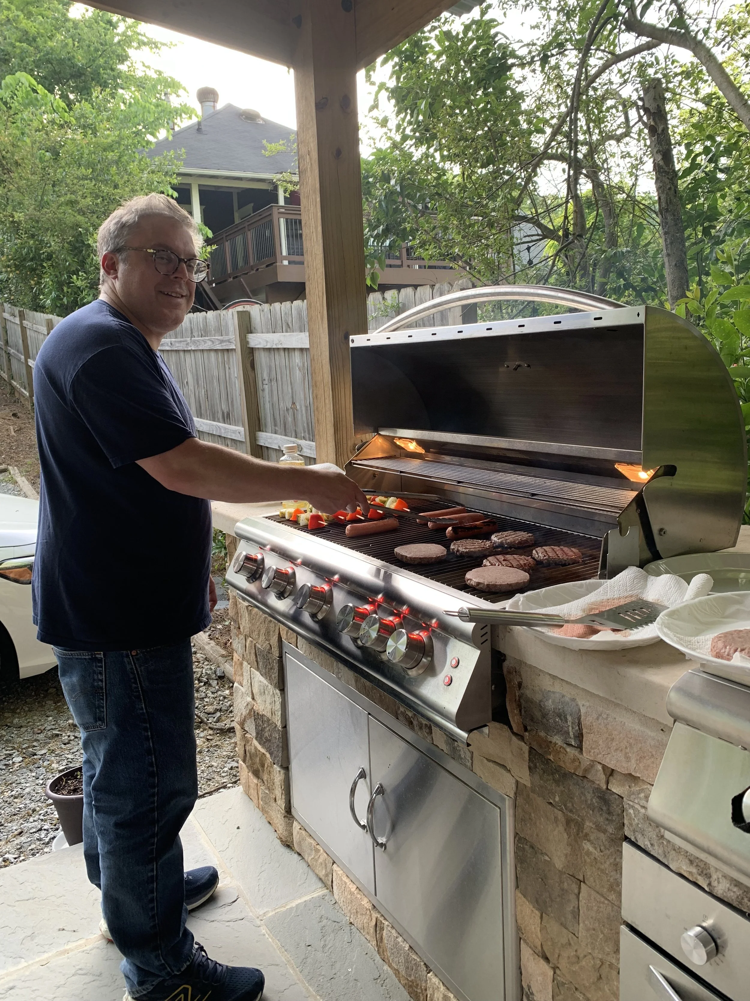 Vinny as grill master at 2025 end of semester lab BBQ.