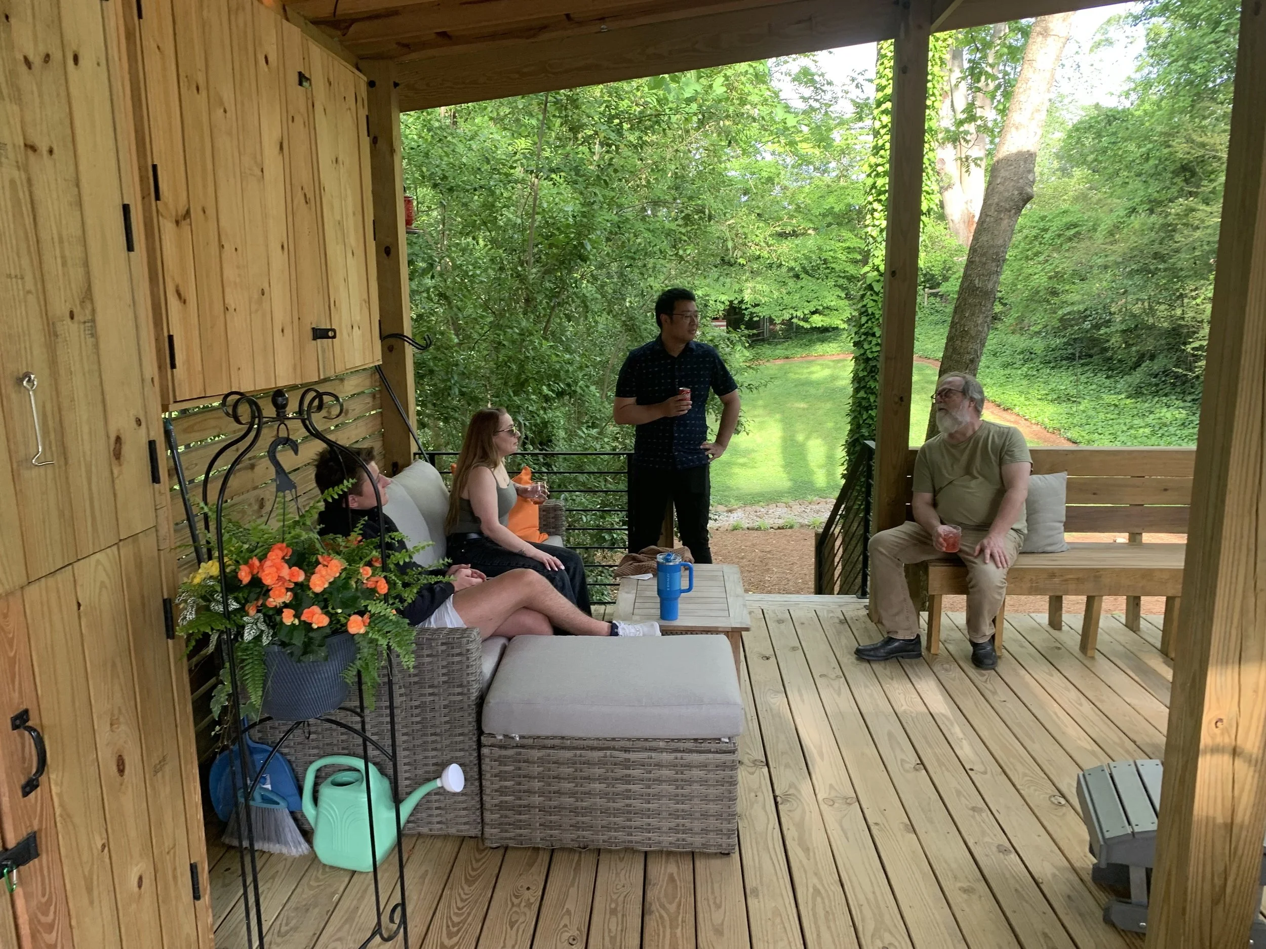 Zach and Kati in conversation with Emory colleagues Drs. Robert Hampton and Jing He at 2025 end of semester lab BBQ. 