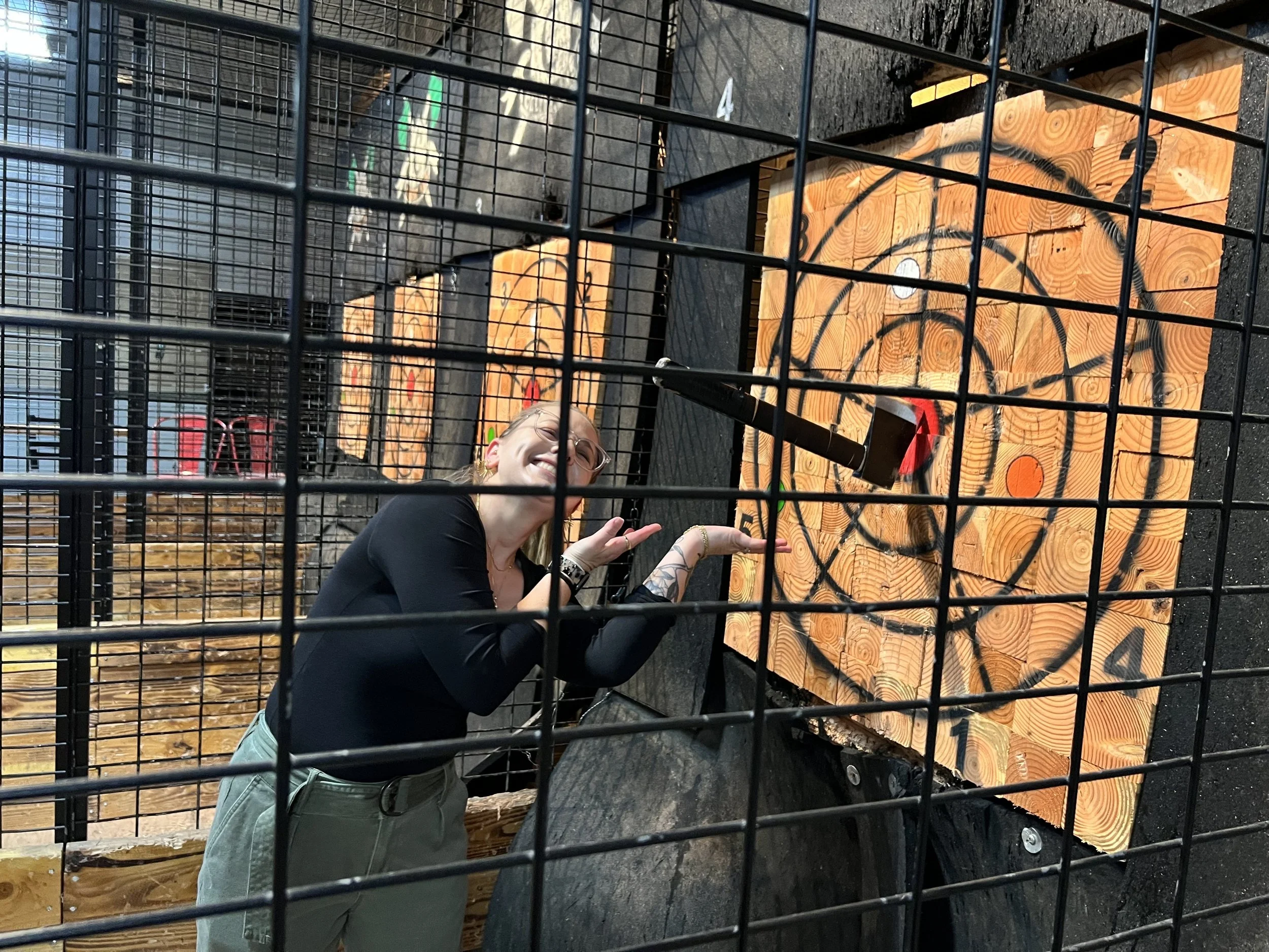 Kati demonstrating her axe throwing abilities.