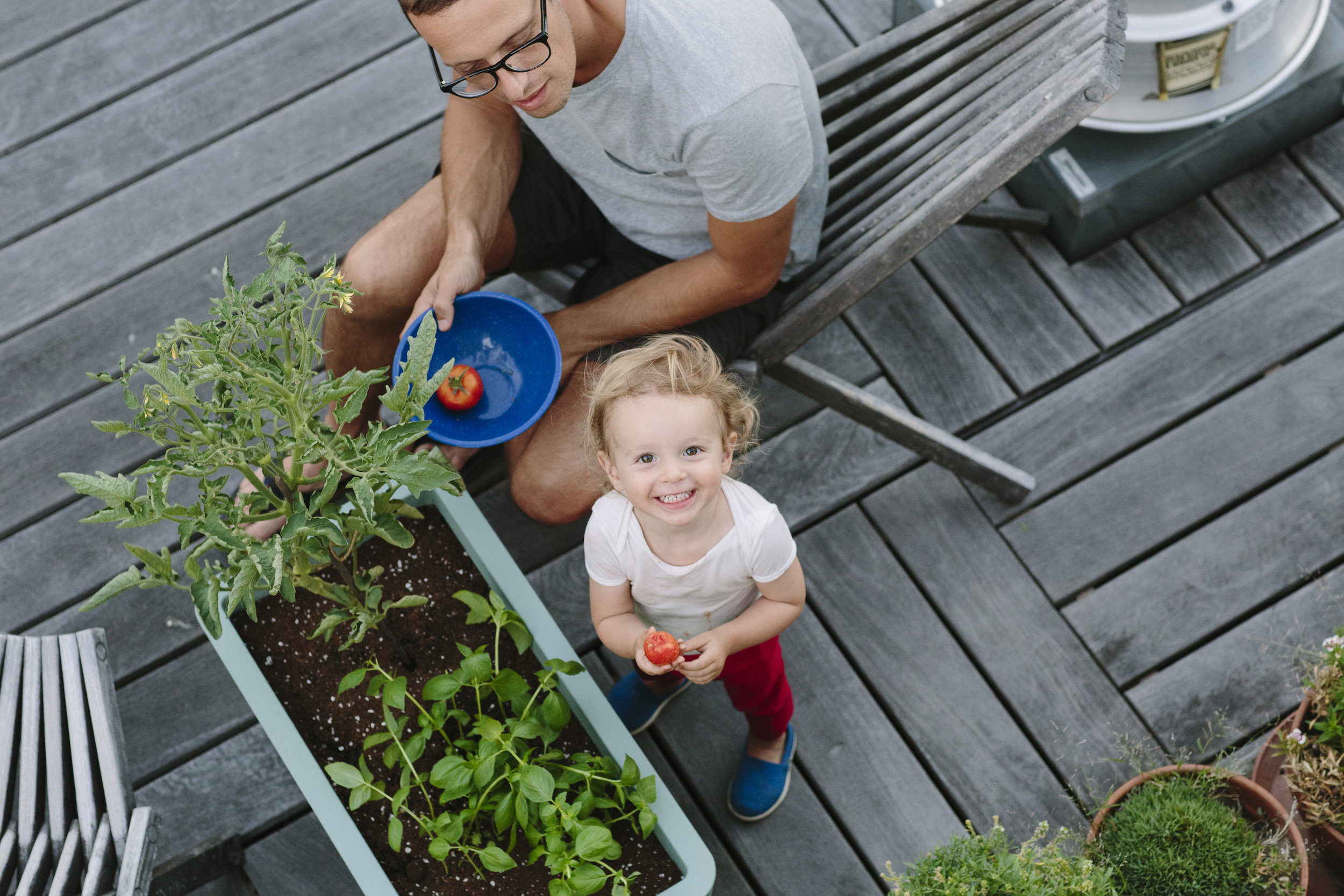 Idan and his daughter Ellie on their rooftop garden in the East Village.