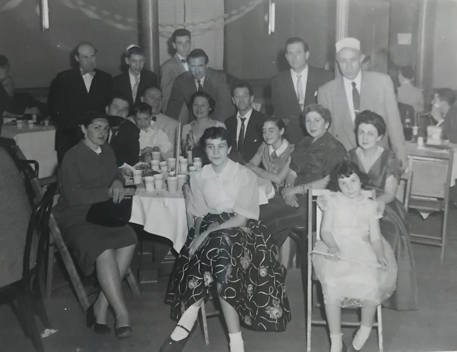 Family photo from cousin Arthur’s Bar Mitzvah, Queens, 1956. Jane is seated (front row all the way to the right) with Bertie seated directly behind her.