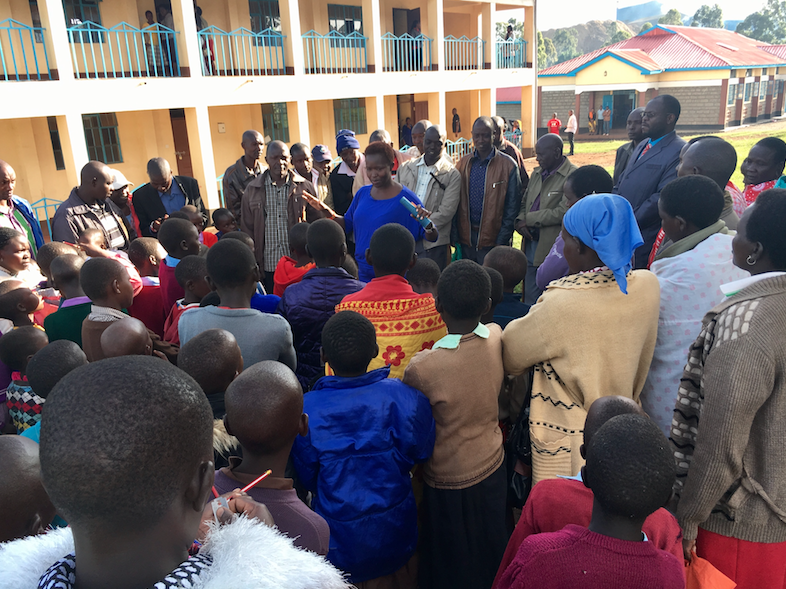 Dr. Ntaiya meets with excited parents and guardians on fourth grade enrollment day (November 2016).