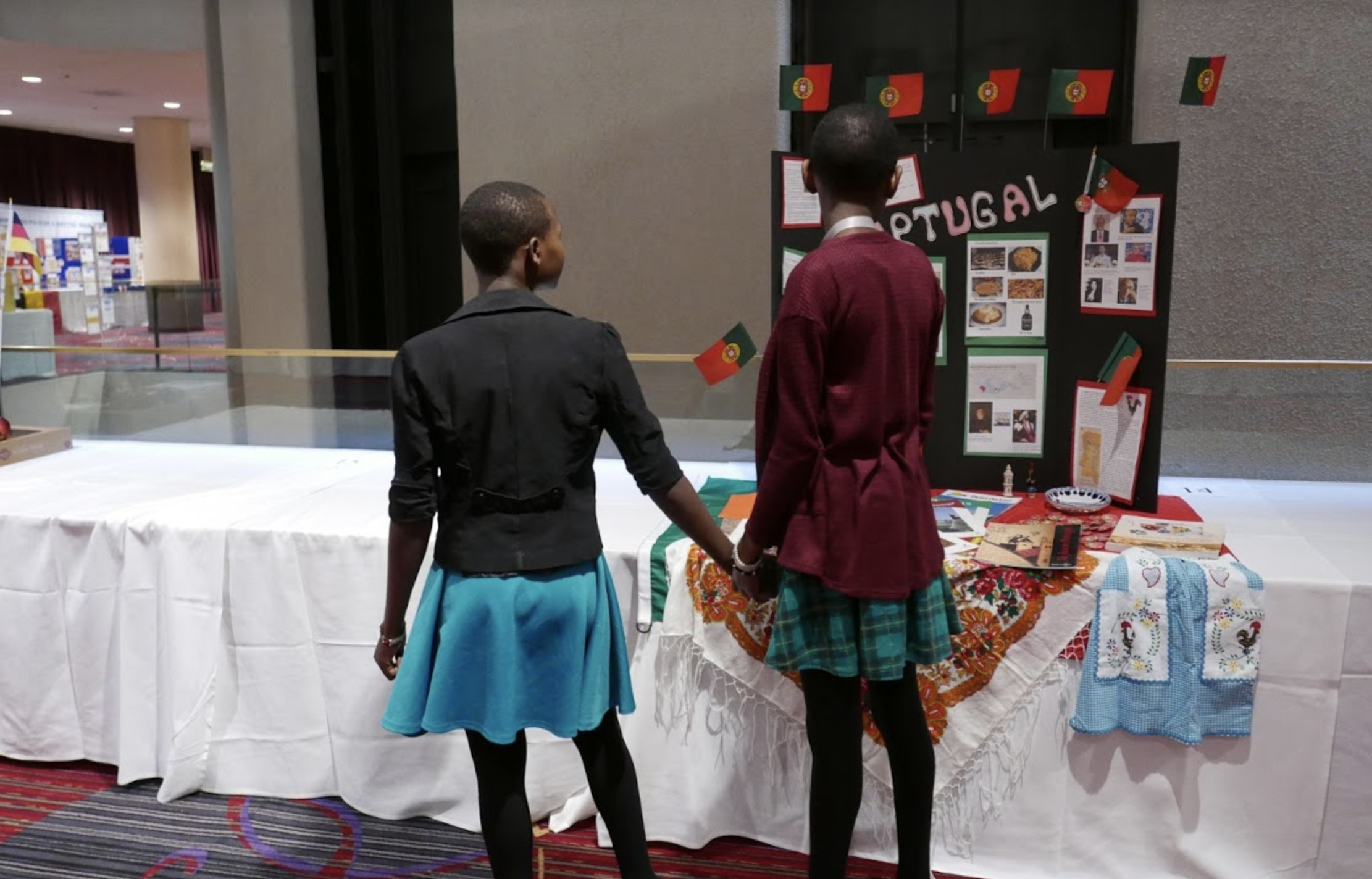 Felisters and Mary check out the Portugal display made by student delegates