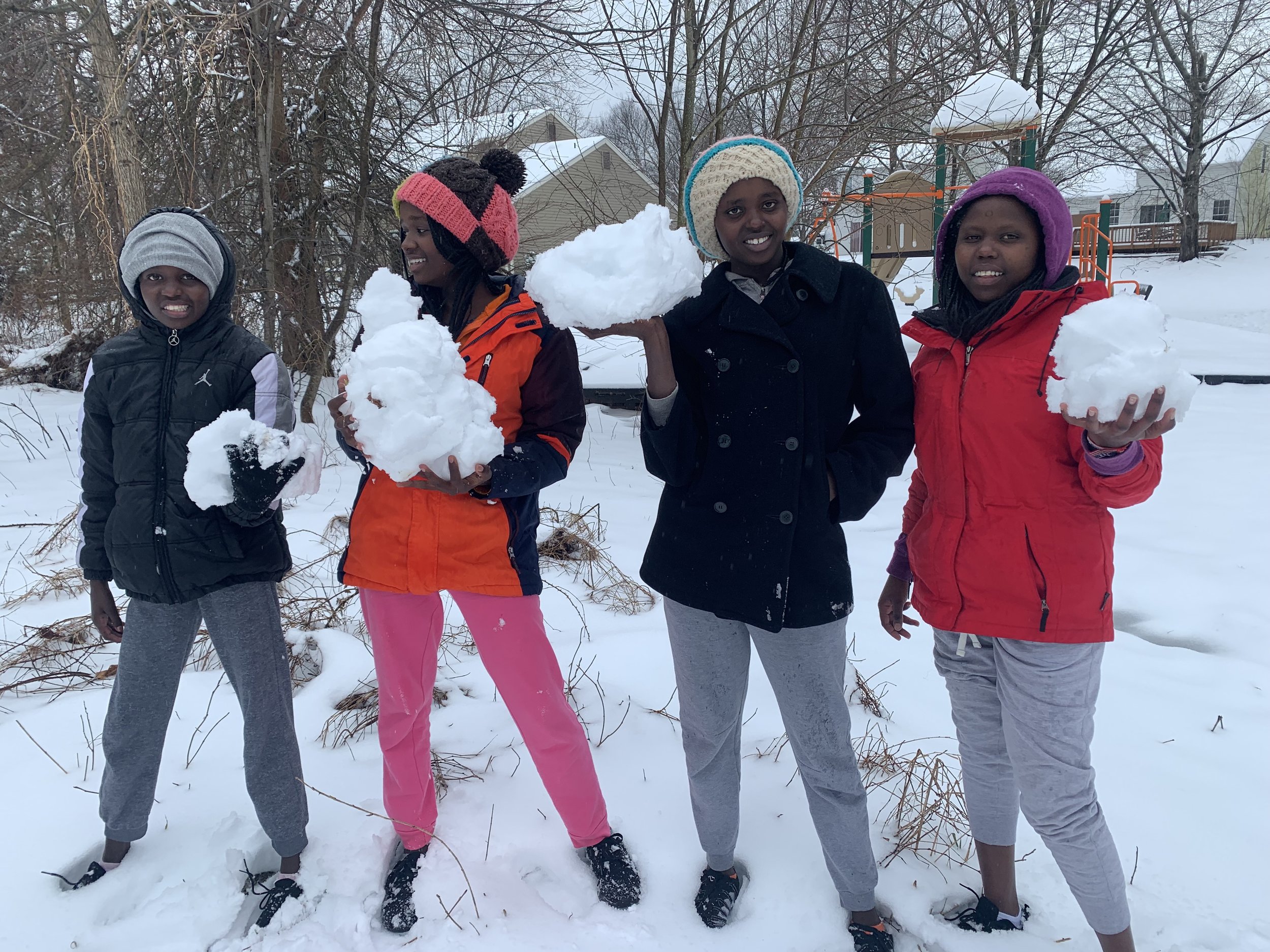 The girls about to build their first snowman!