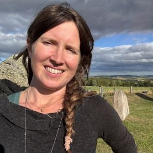 Ritual Health Acupuncture in Berkeley's Anne Shelton Crute smiles in a grassy field