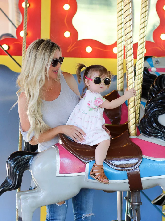 She was slightly nervous here, before it started, but as we got to moving,&nbsp;she laid back into my arm, and was smiles and cheers the whole time...such a cutie pie...and of course she had to wear her sunnies..ha!