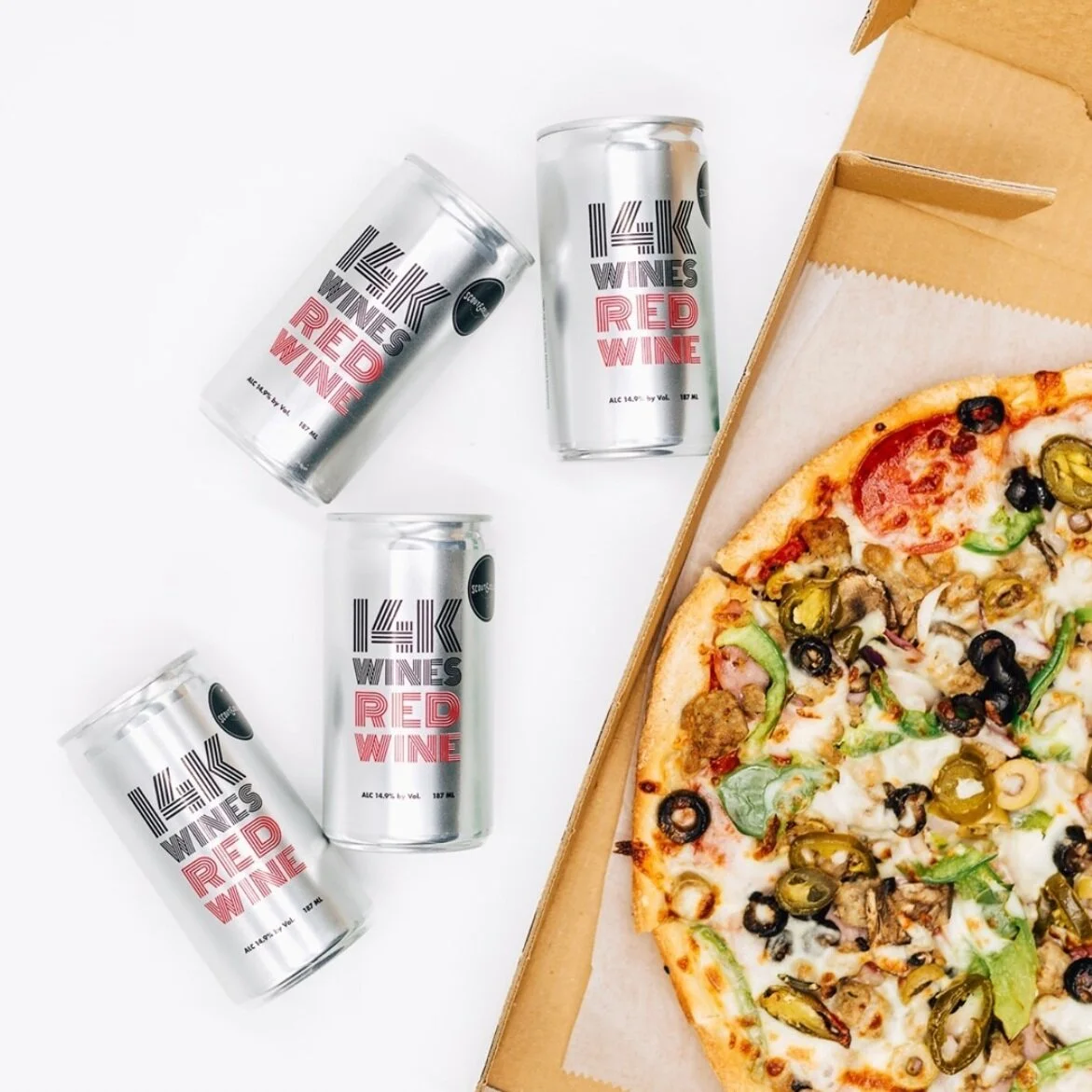 It's #PizzaNight done right with our 14K Red Wine!⁠ We're keeping it casual this Monday evening with this juicy, full-bodied canned red wine and a few of our favorite slices. What's your favorite topping? Drop an emoji in the comments to let us know…