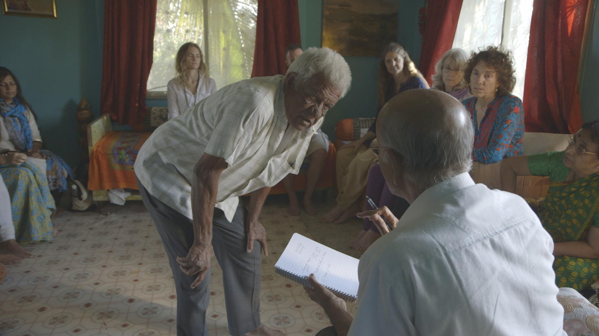 Dr. Lad seeing man from the local village while at his ancestral family home with students in Pune, India.