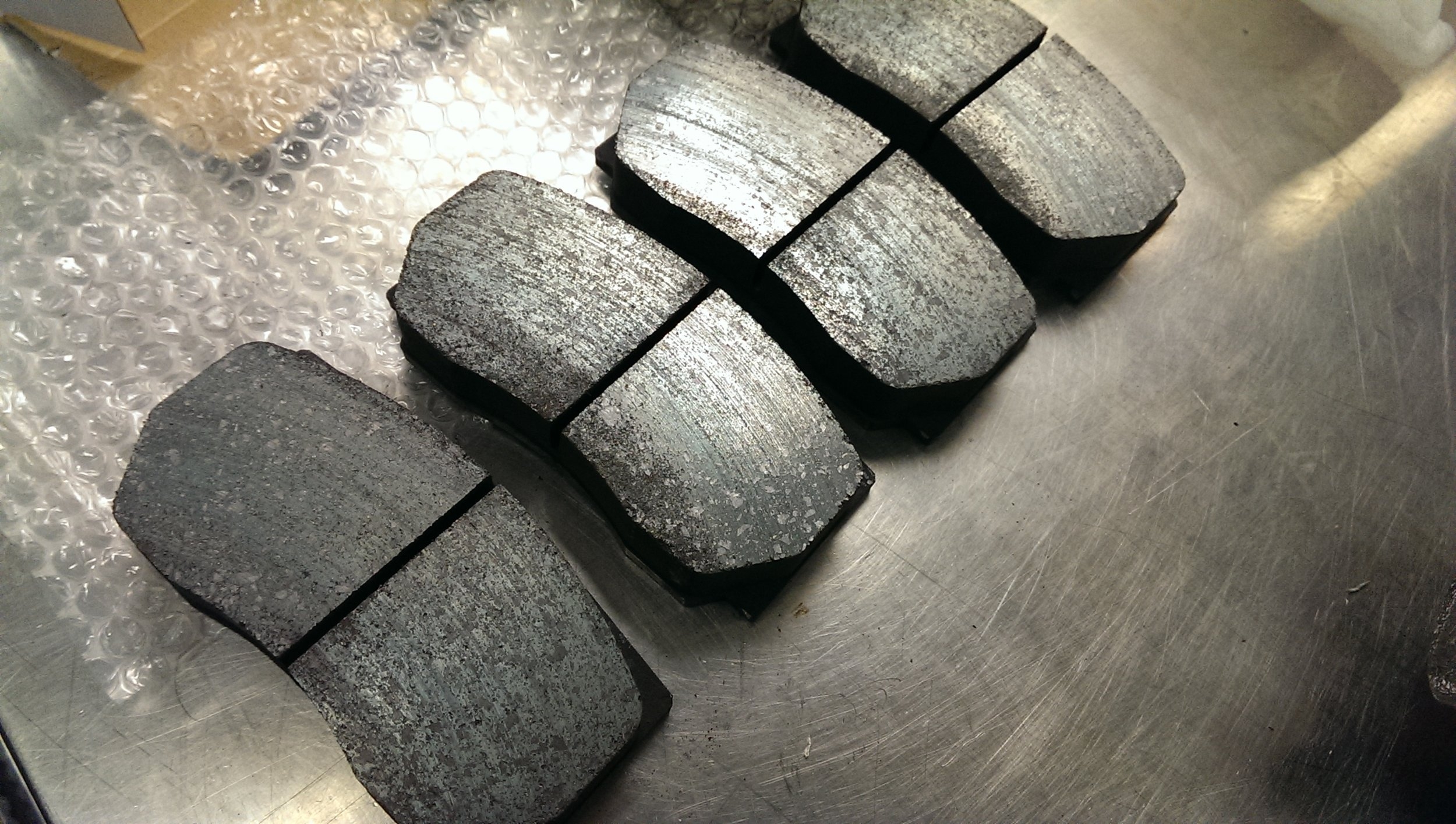 PRE-BEDDED BRAKE PADS BEING USED BY AN IMSA CONTINENTAL TIRE TEAM. PHOTO CREDIT: GANESH KRISHNAN