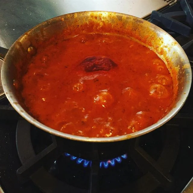 Skye's favorite part of spaghetti is the sauce mustache. Making spaghetti mustaches starts with the sauce. Why does tomato sauce #splash and #splatter so much on the stove? We posted a blog about this on our website.  #viscosity #tomatoes #tomatosauc