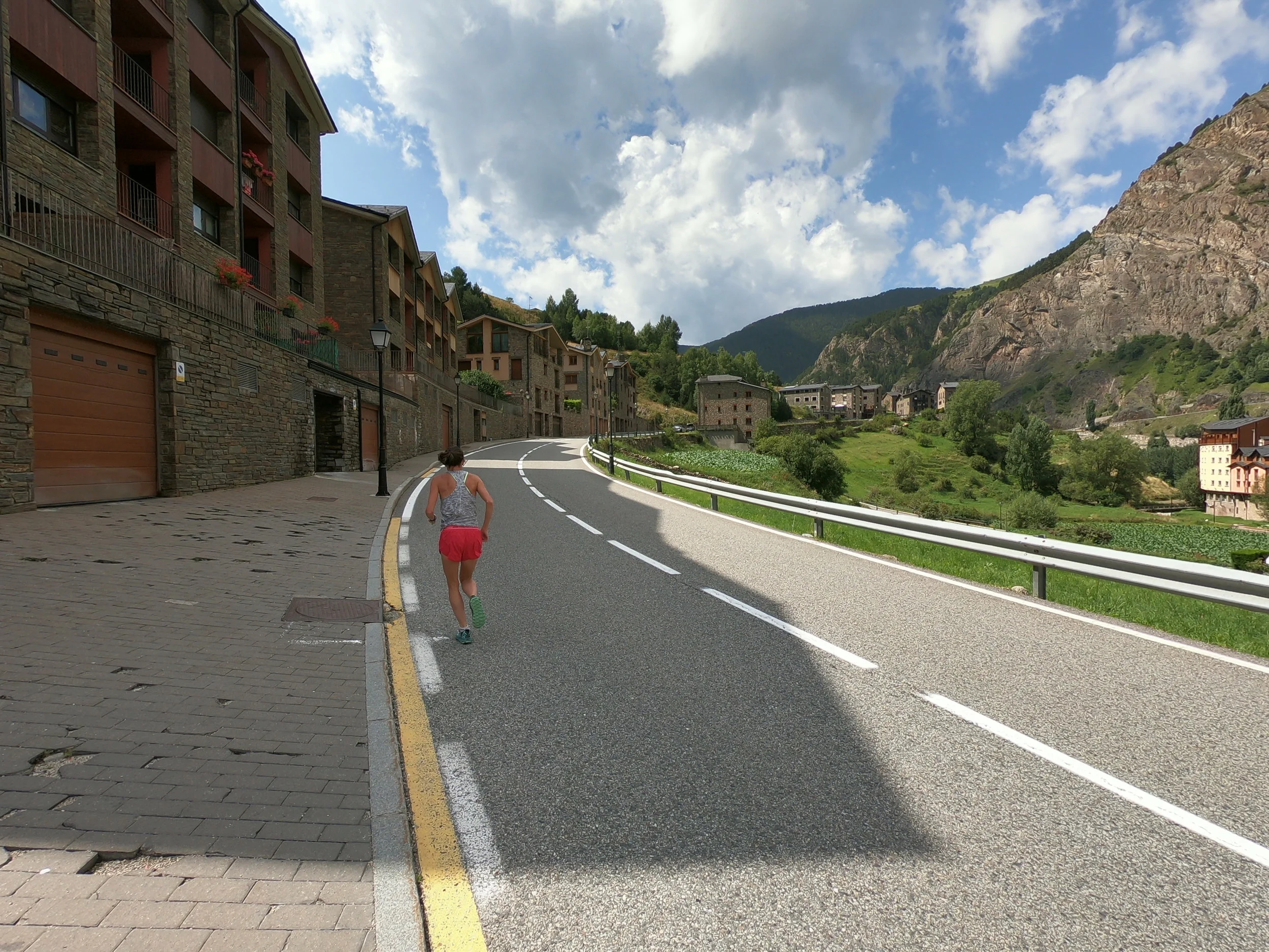 Emily (in pink shorts) running on the asphalt section. The first 1.3 km are a steady uphill (average gradient of 7%).