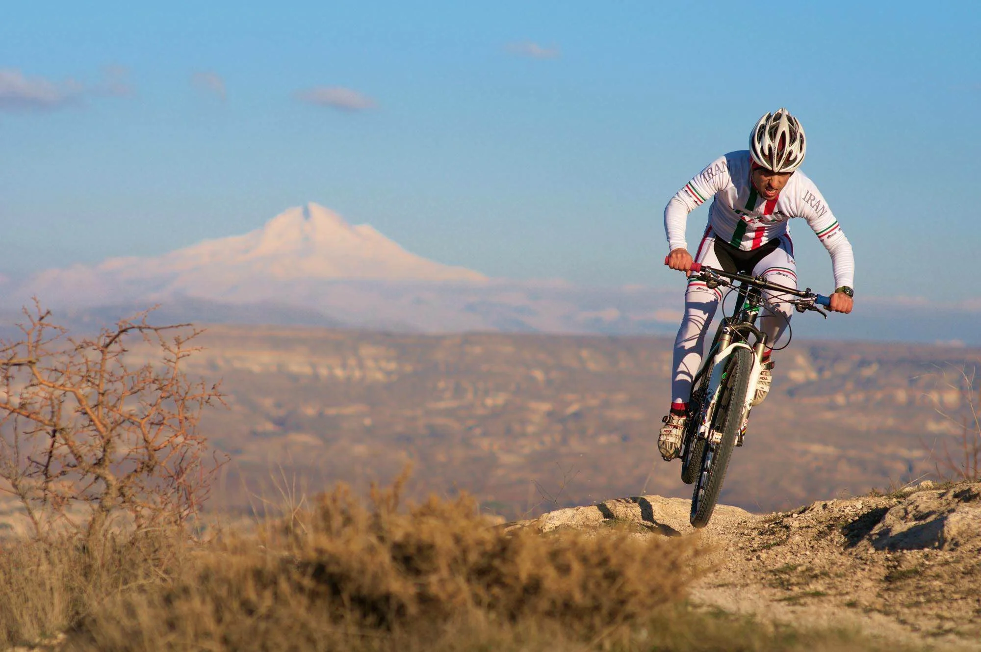 Sina racing in Turkey, Erciyes Peak in the background. Copyright Seb Rogers - https://www.cranked.cc/