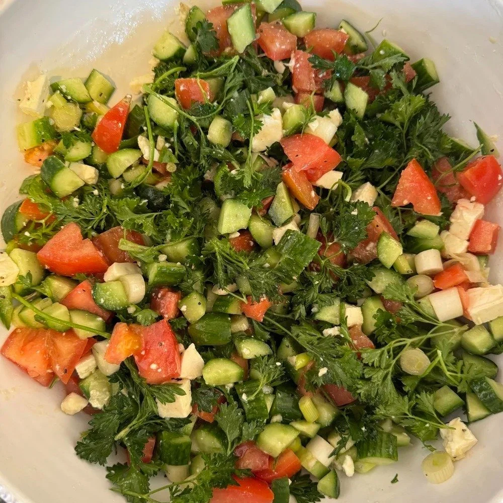 Becca planted a beautiful herb garden into her greenhouse last year and the herbs survived over the winter.  The massive, luscious bunches of parsley, and loads of green onions inspired her to create a mediterranean style salad that included lots of 