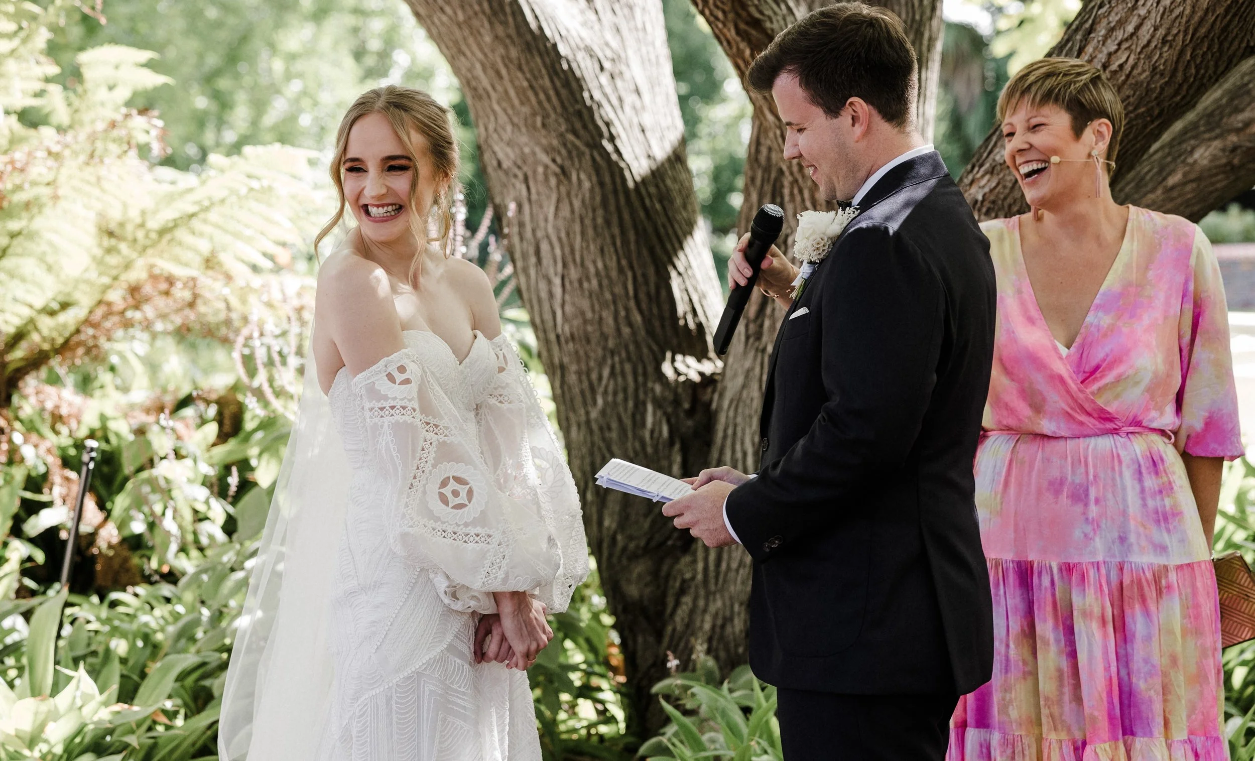 Adelaide Hills Marriage celebrant Penelope laughing with bride and Groom at their wedding ceremony